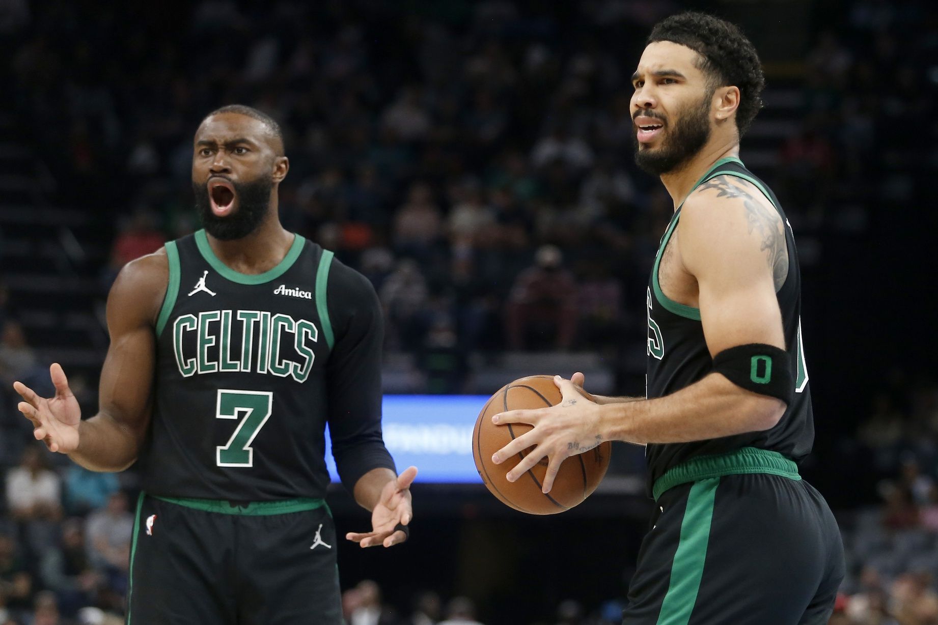 Boston Celtics guard Jaylen Brown (7) and forward Jayson Tatum (0) react during the third quarter against the Memphis Grizzliesat FedExForum.