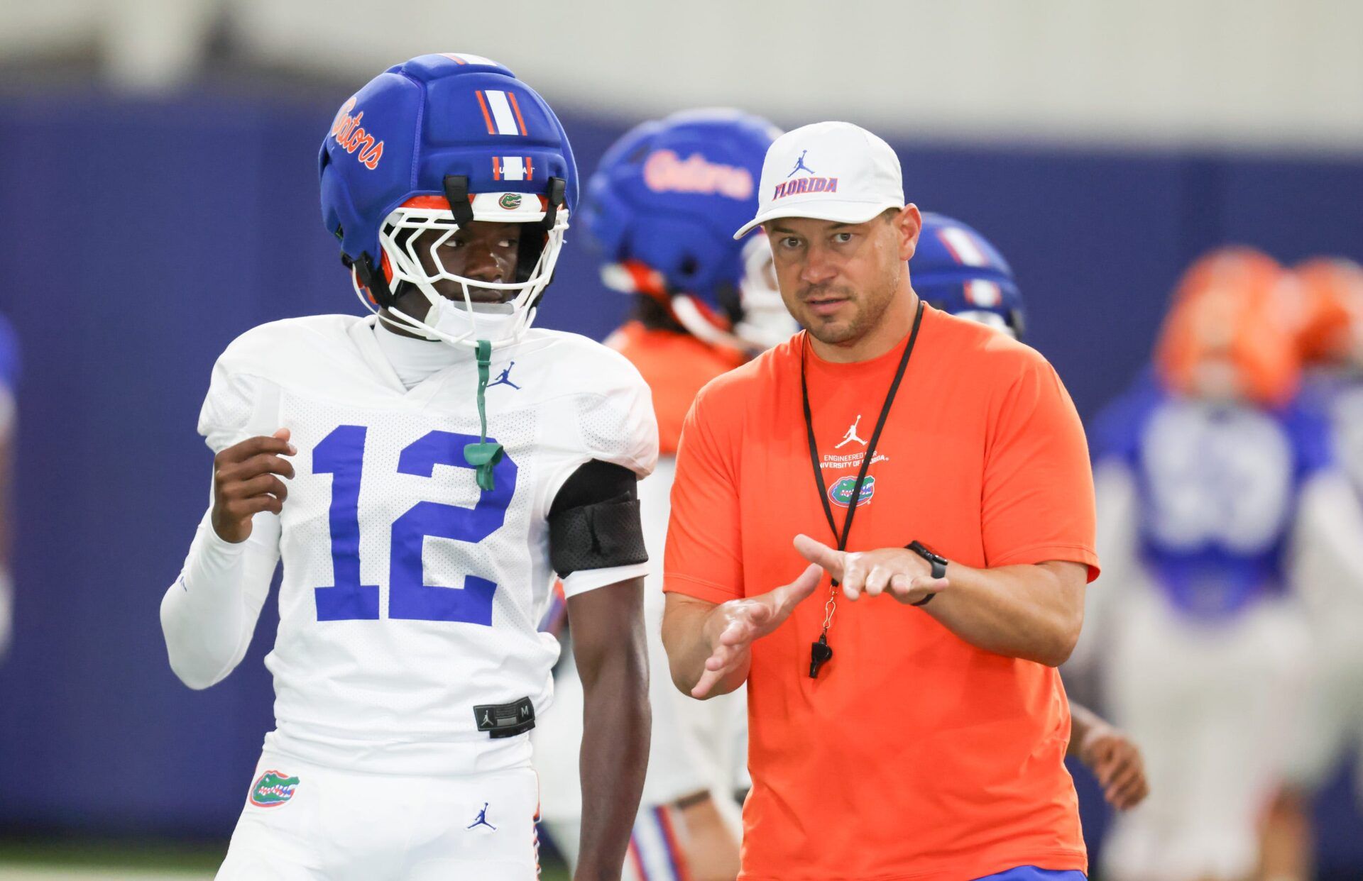 Florida head coach Jon Sumrall talks with Florida cornerback Ben Hanks II (12) during practice during spring practice at Sanders Practice Fields in Gainesville, FL on Thursday, April 2, 2026. [Alan Youngblood/Gainesville Sun]