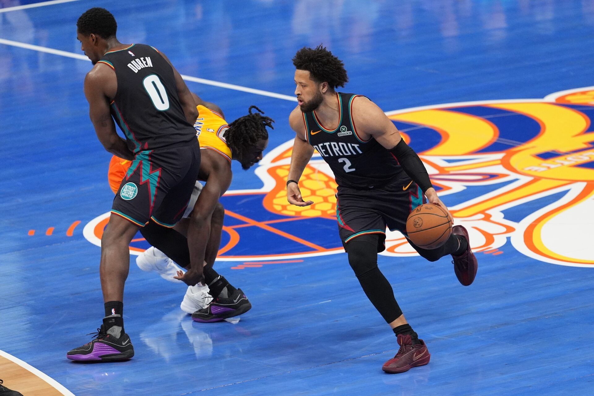 Detroit Pistons guard Cade Cunningham (2) dribbles the ball as center Jalen Duren (0) blocks Charlotte Hornets guard Sion James (4) during the second quarter at Spectrum Center.