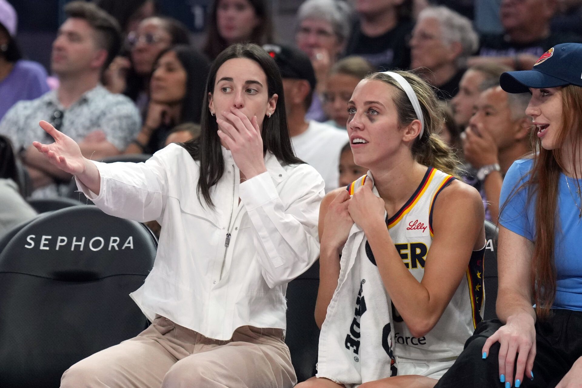 Indiana Fever guard Caitlin Clark (center left) talks with guard Lexie Hull (center right) during the second quarter against the Golden State Valkyries at Chase Center.