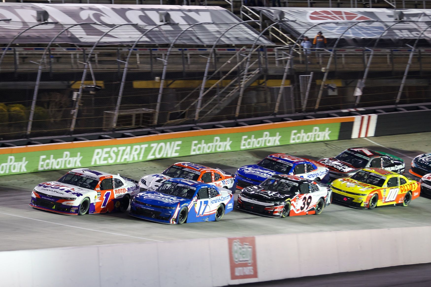 JR Motorsports driver Connor Zilisch (1) and Hendrick Motorsports driver Corey Day (17) lead a restart at Bristol Motor Speedway.