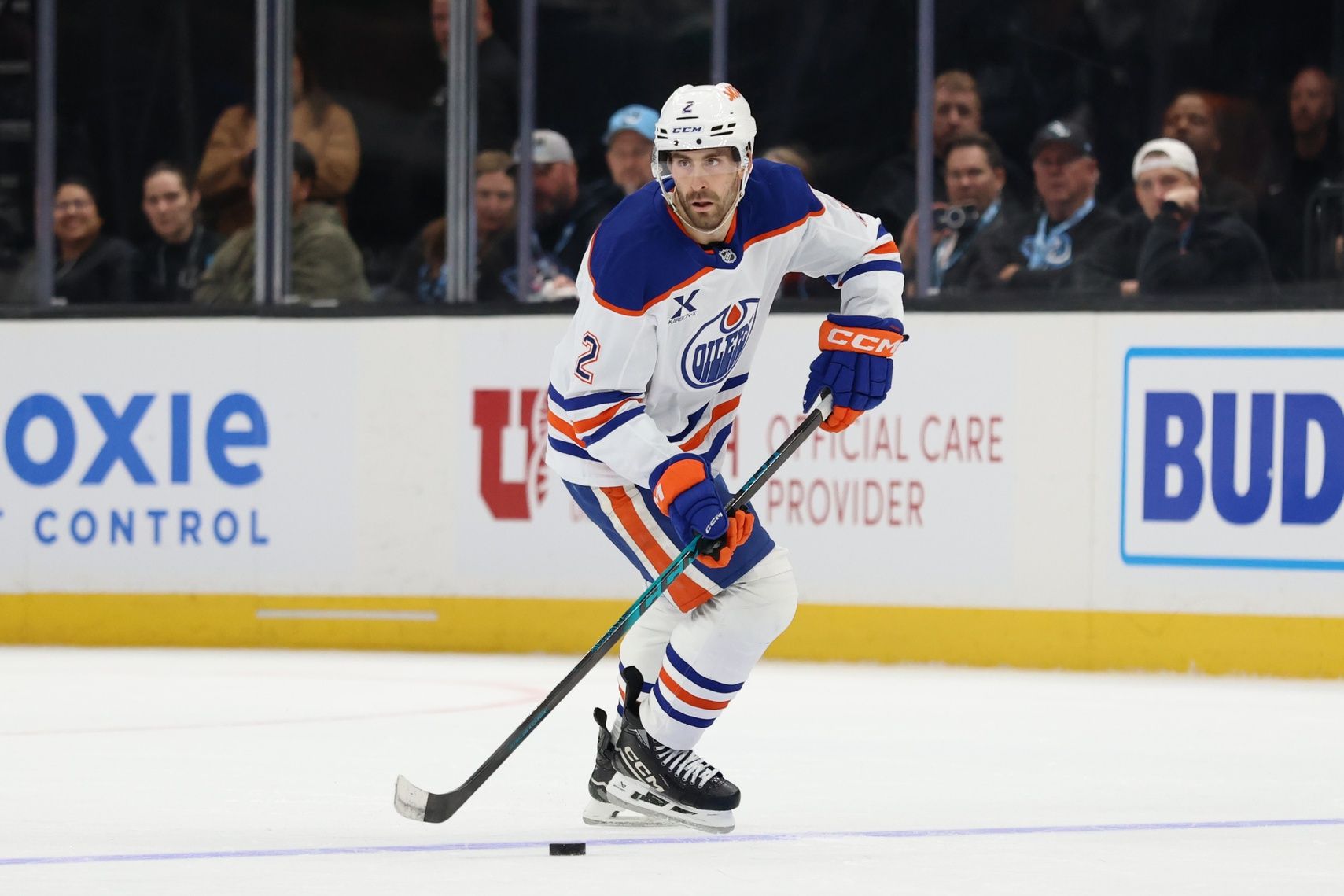 Edmonton Oilers defenseman Evan Bouchard (2) skates with the puck against the Utah Mammoth during overtime at Delta Center.