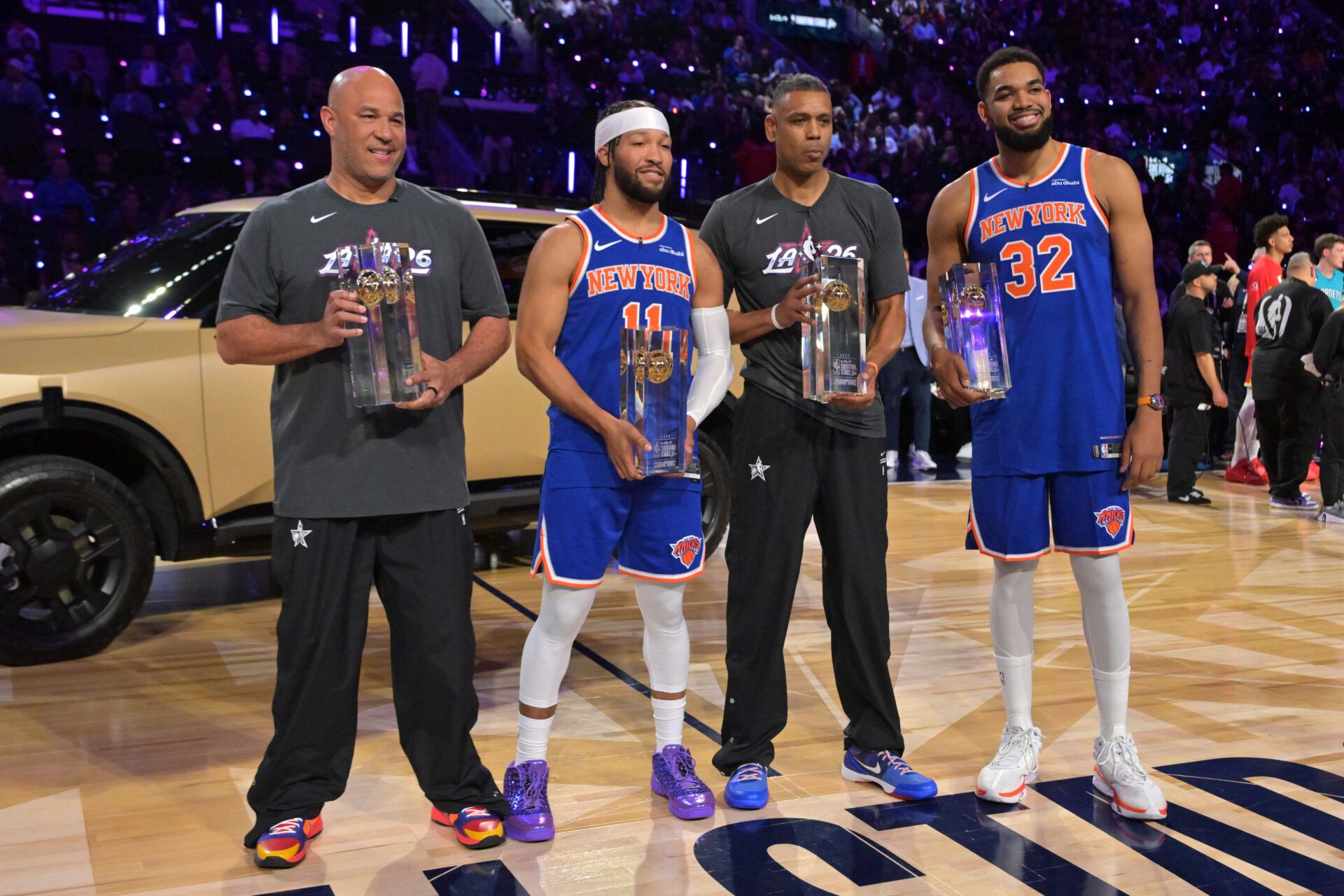 Team Knicks guard Jalen Brunson (11) and center Karl-Anthony Towns (32) of the New York Knicks and NBA legend Allan Houston and passer Rick Brunson celebrate after winning the shooting stars competition during the 2026 NBA All Star Saturday Night at Intuit Dome.