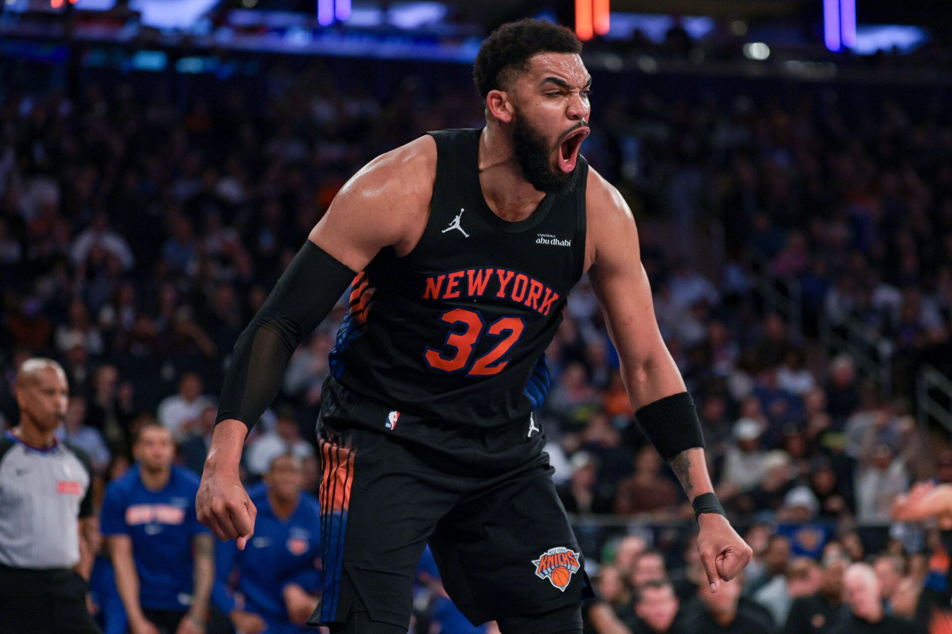 New York Knicks center Karl-Anthony Towns (32) reacts after a dunk against the Toronto Raptors during the second half at Madison Square Garden.