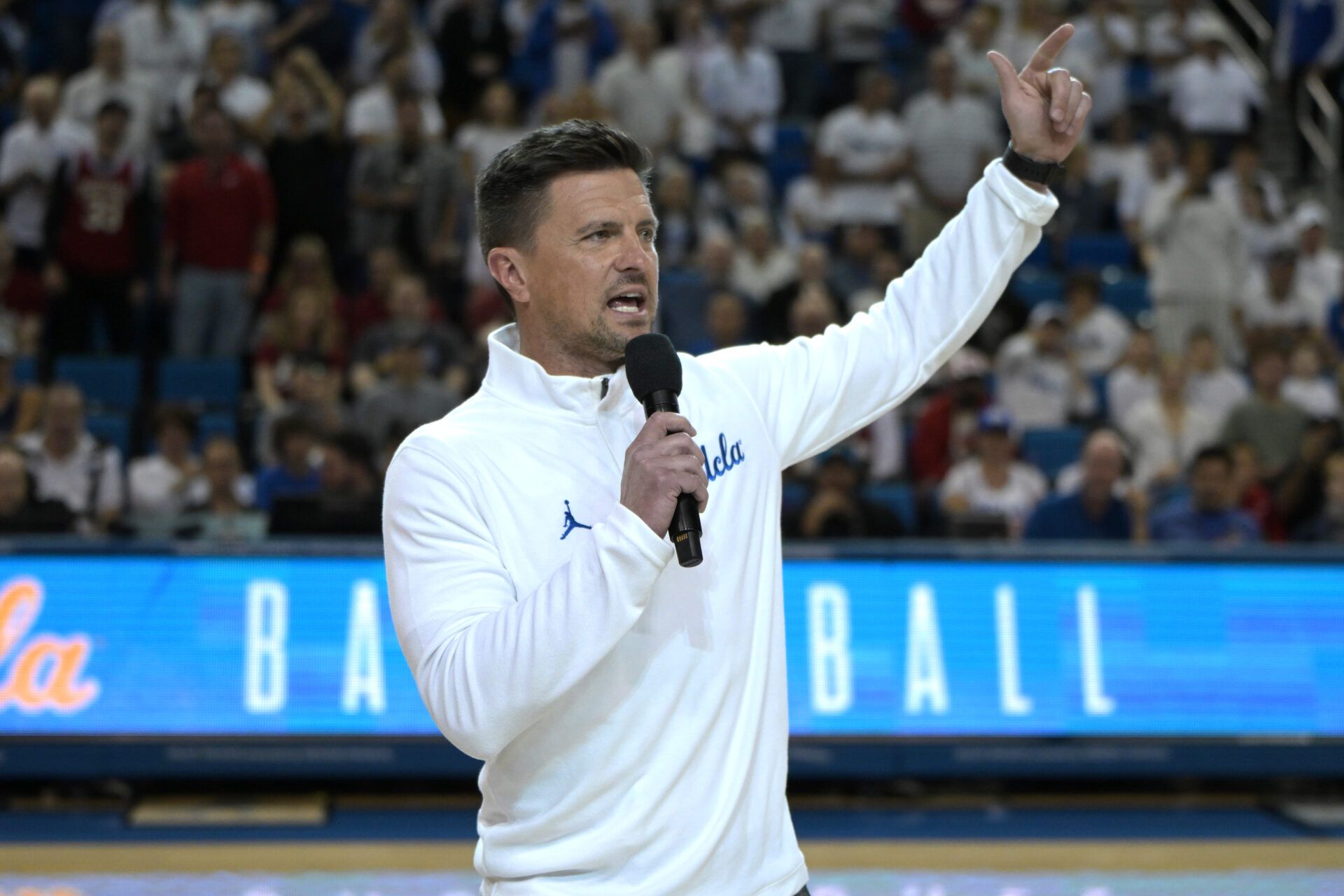 UCLA Bruins head football coach Bob Chesney is introduced during the basketball game against the Indiana Hoosiers at Pauley Pavilion presented by Wescom Financial.