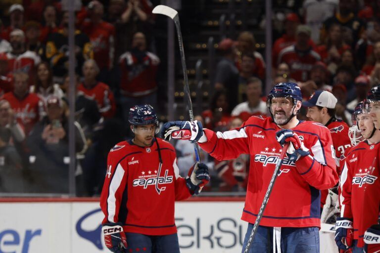 Washington Capitals left wing Alex Ovechkin (8) smiles while waving off a handshake line by the Pittsburgh Penguins after their game at Capital One Arena.