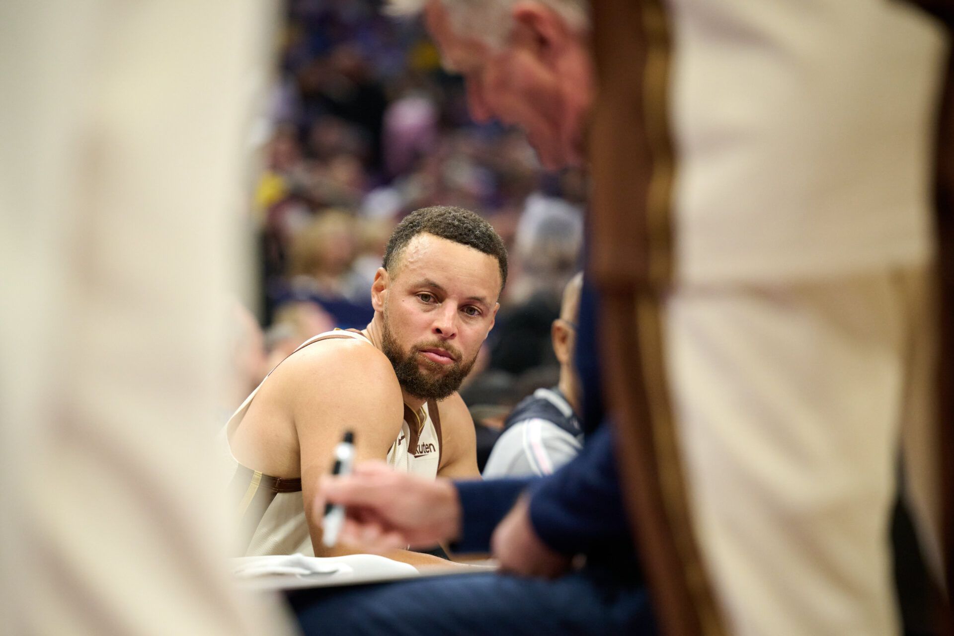 Golden State Warriors guard Stephen Curry (30) looks on as head coach Steve Kerr draws up a play against the Sacramento Kings during the first quarter at Golden 1 Center.