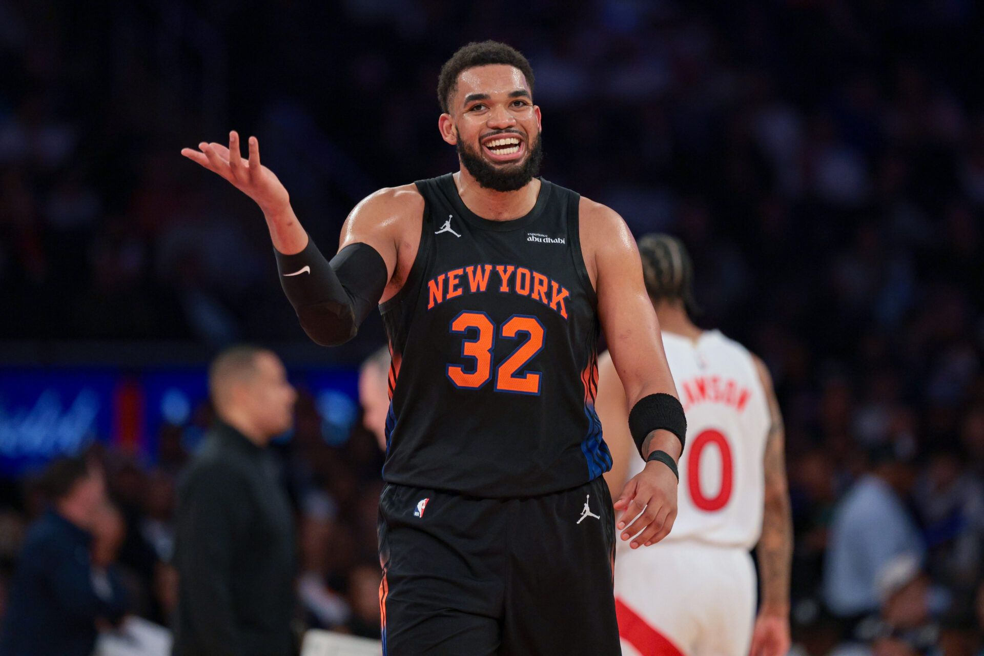 New York Knicks center Karl-Anthony Towns (32) reacts after a dunk against the Toronto Raptors during the second half at Madison Square Garden.