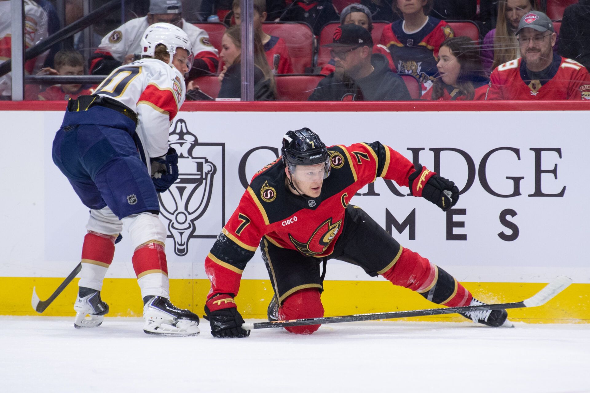 Ottawa Senators left wing Brady Tkachuk (7) falls after battling with Florida Panthers center Jesper Boqvist (70) in the first period at the Canadian Tire Centre.
