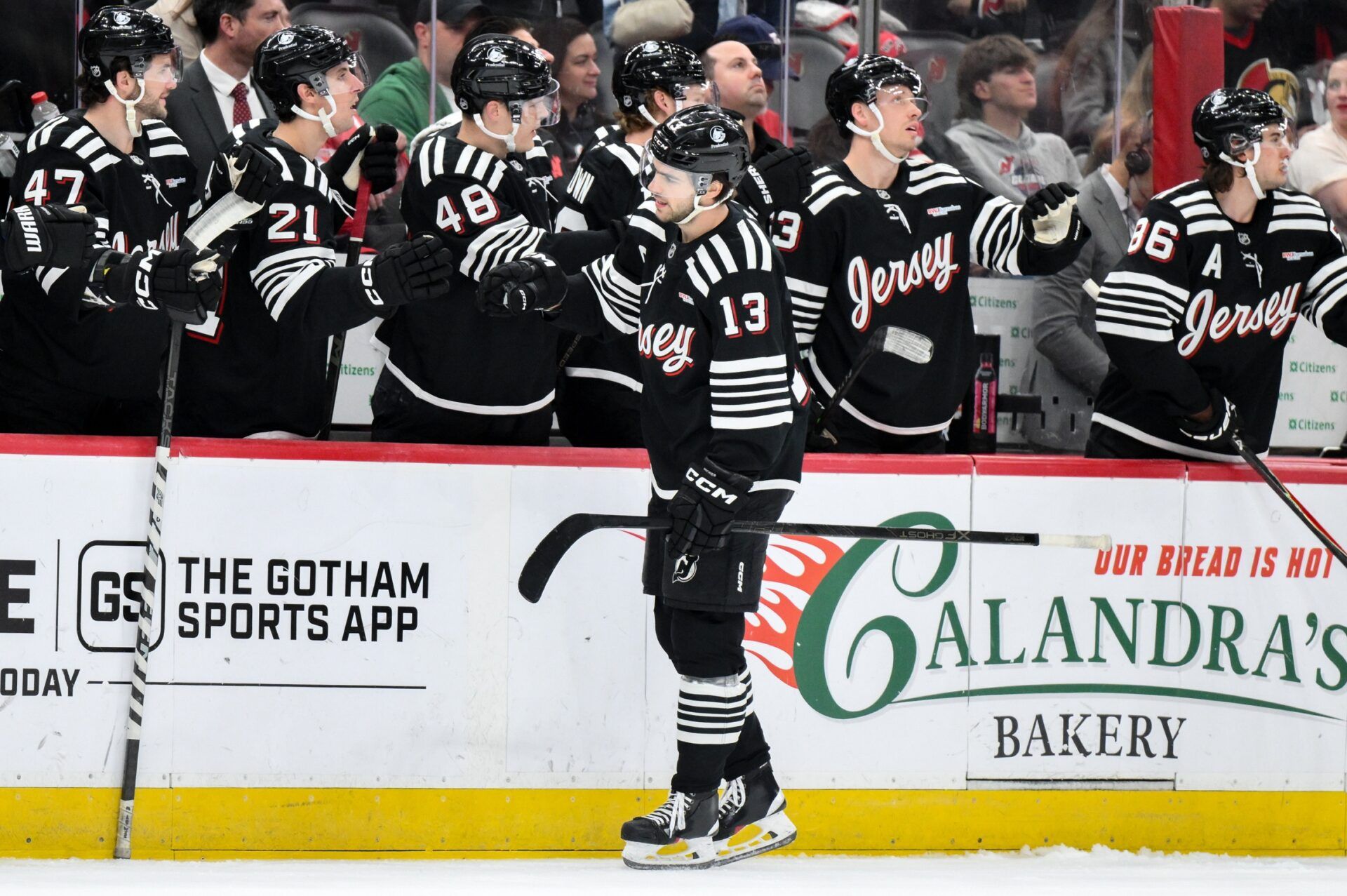 New Jersey Devils center Nico Hischier (13) celebrates with teammates after scoring a goal against the Ottawa Senators during the first period at Prudential Center.