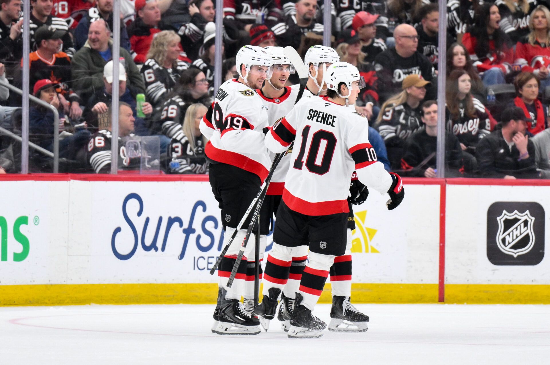 Ottawa Senators center Shane Pinto (12) celebrates with teammates after scoring a goal against the New Jersey Devils during the second period at Prudential Center.