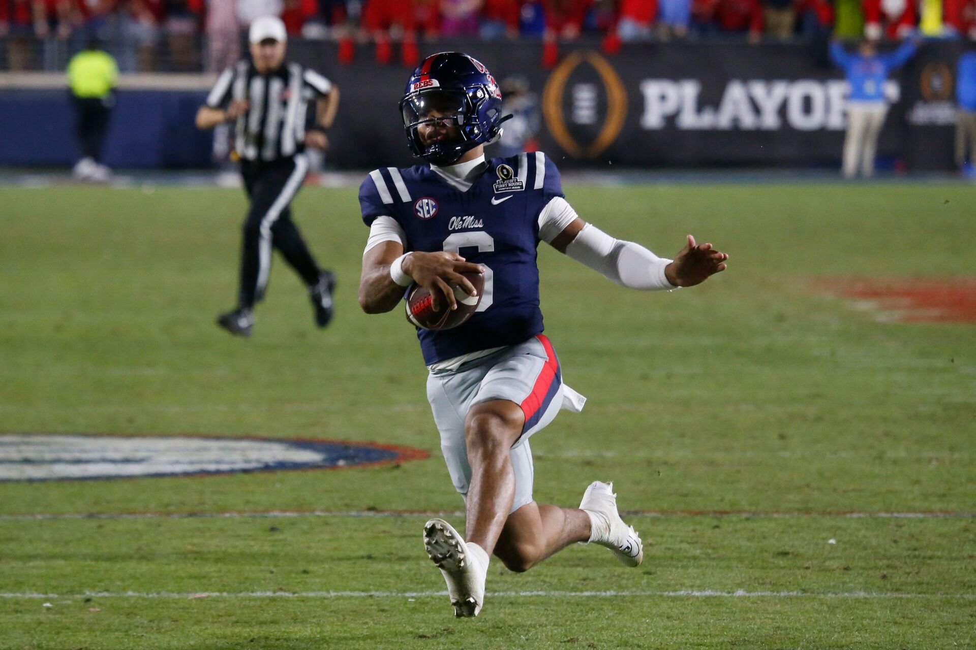 Mississippi Rebels quarterback Trinidad Chambliss (6) carries the ball Tulane Green Wave during the second half of a game at Vaught-Hemingway Stadium.