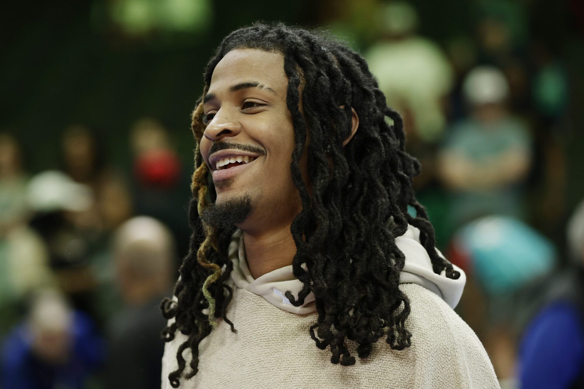 Memphis Grizzlies guard Ja Morant stands on the court following the game against the Charlotte Hornets at Spectrum Center.