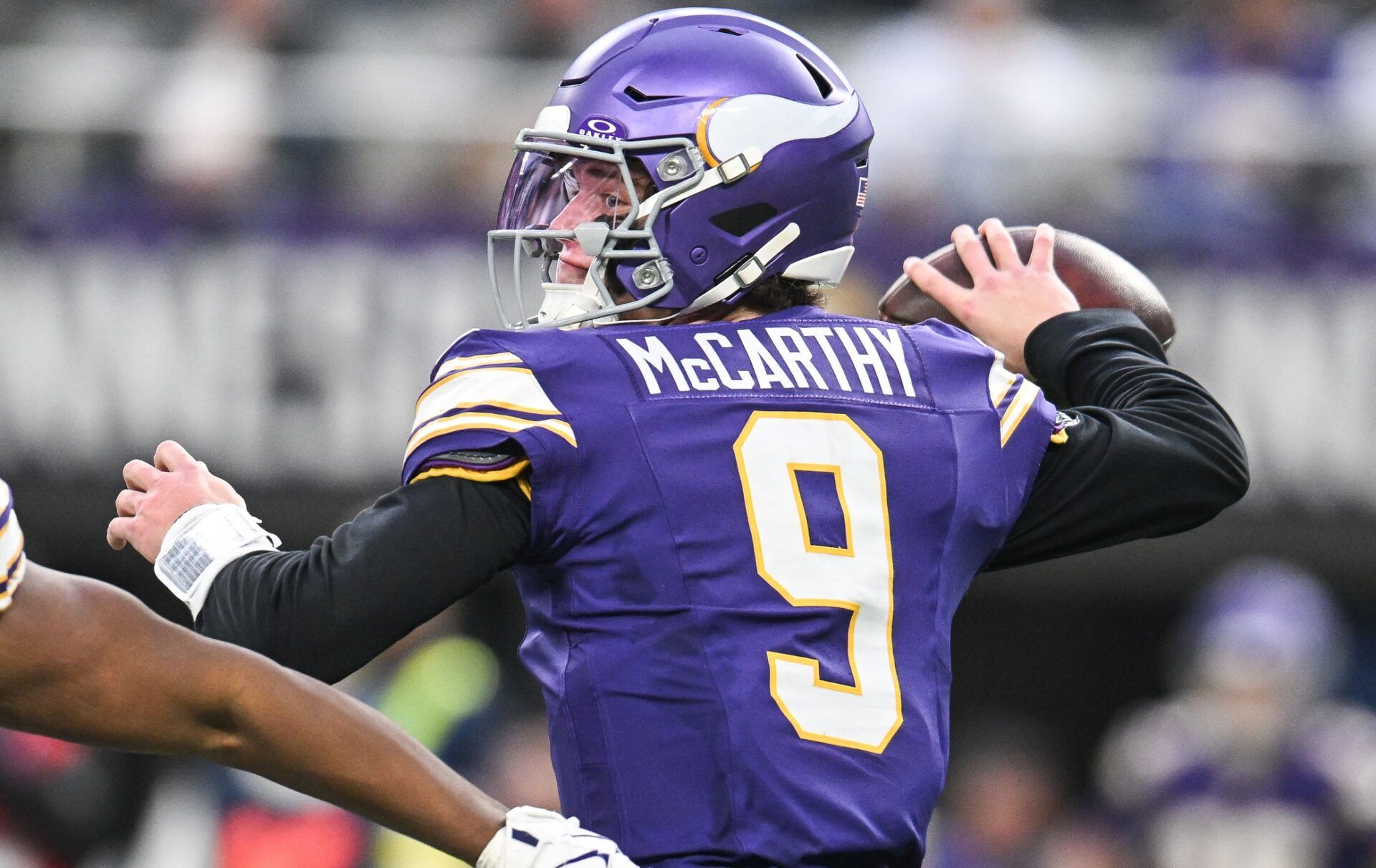 Minnesota Vikings quarterback J.J. McCarthy (9) throws a pass against the Green Bay Packers during the first quarter at U.S. Bank Stadium.