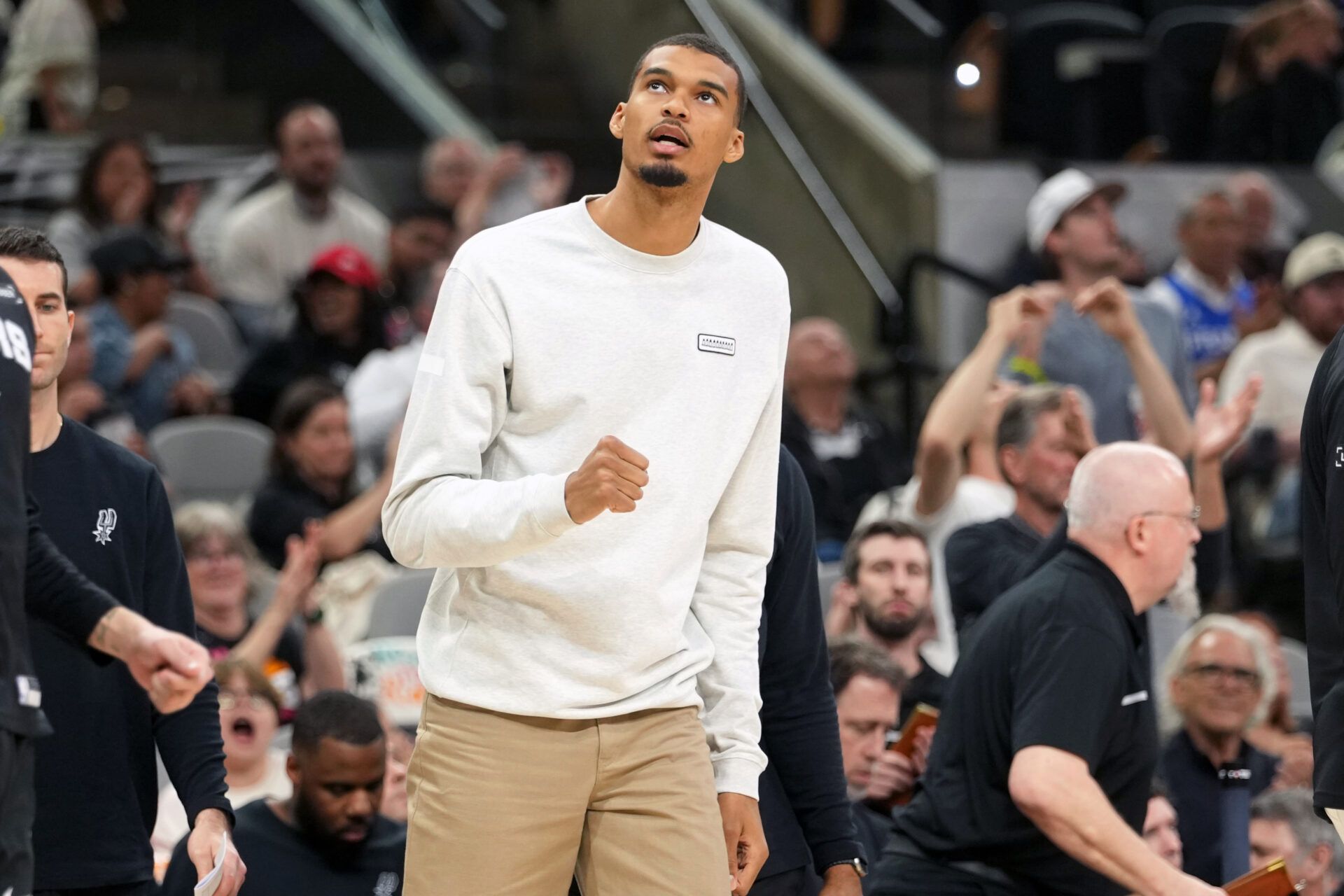 San Antonio Spurs forward Victor Wembanyama (1) reacts from the bench during the second half against the Denver Nuggets at Frost Bank Center.