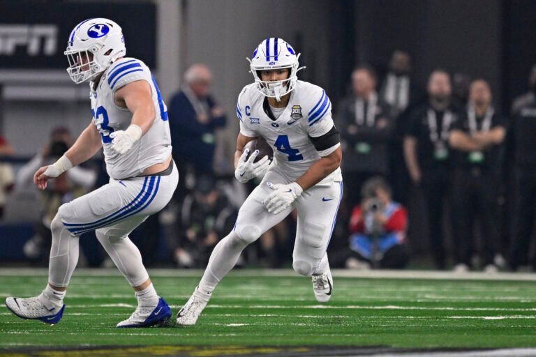 BYU Cougars running back LJ Martin (4) runs with the ball during the game between the Red Raiders and the Cougars at AT&T Stadium.