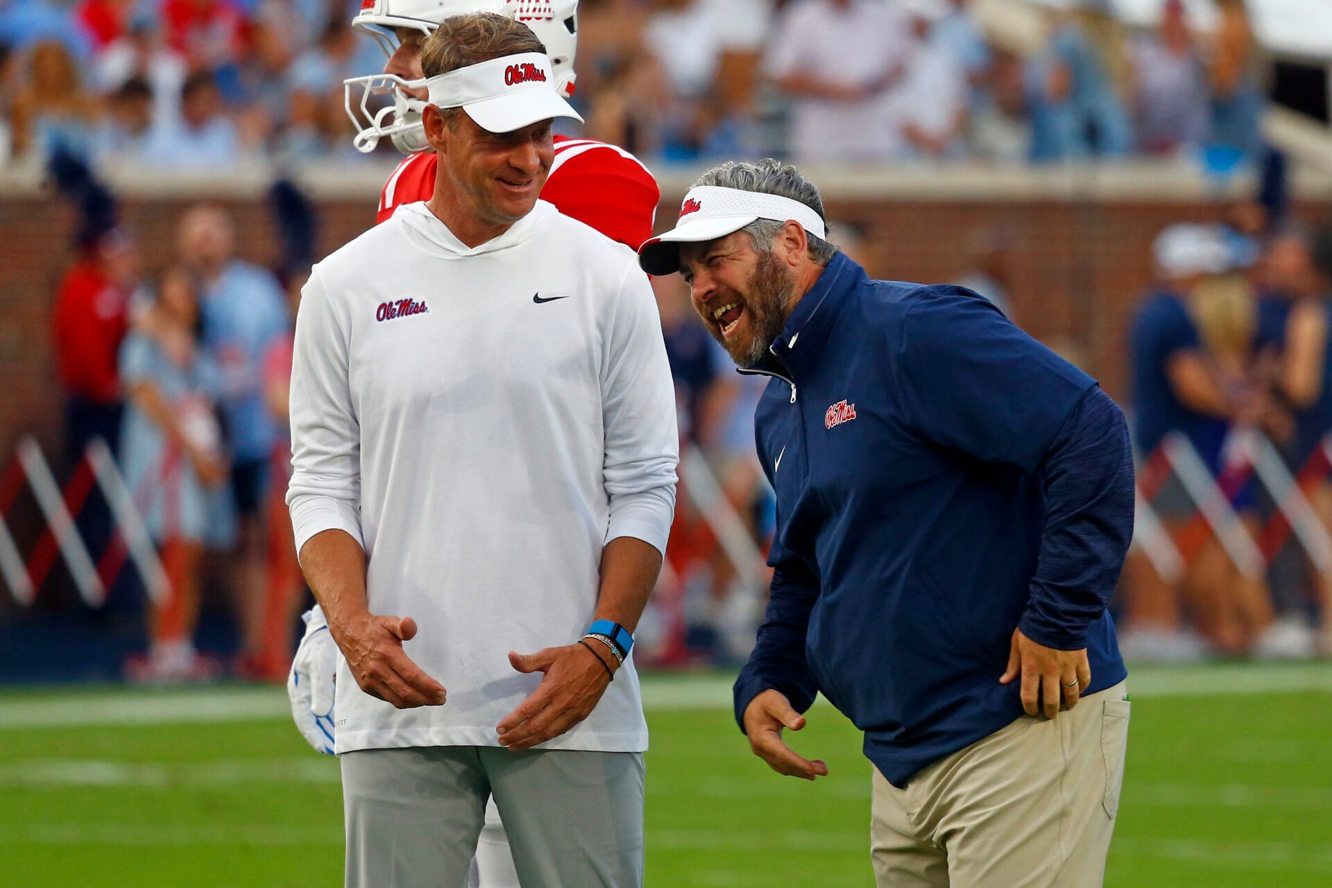 Mississippi Rebels head coach Lane Kiffin (left) shares a laugh with defensive coordinator Pete Golding (right) during warm ups prior to the game against the Georgia Southern Eagles at Vaught-Hemingway Stadium.