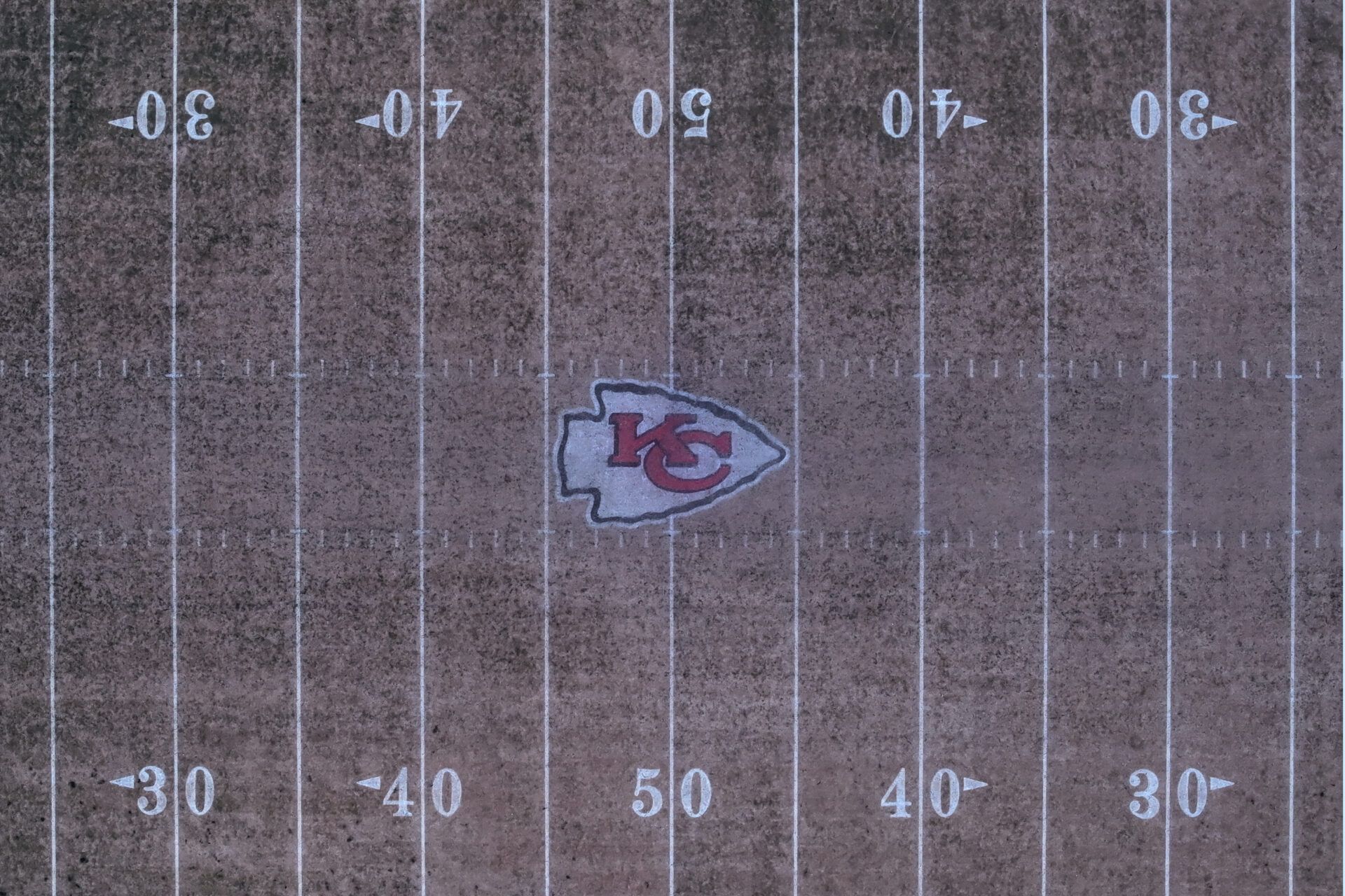 The Kansas City Chiefs logo at midfield at Arrowhead Stadium at the Truman Sports Complex.