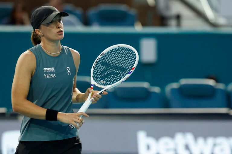 Iga Swiatek (POL) reacts after missing a shot against Magda Linette (POL) (not pictured) on day three of the 2026 Miami Open at Hard Rock Stadium.
