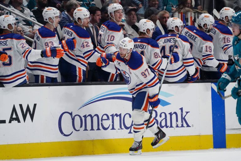 Edmonton Oilers center Connor McDavid (97) is congratulated by the bench after scoring a goal in the second period at SAP Center at San Jose.