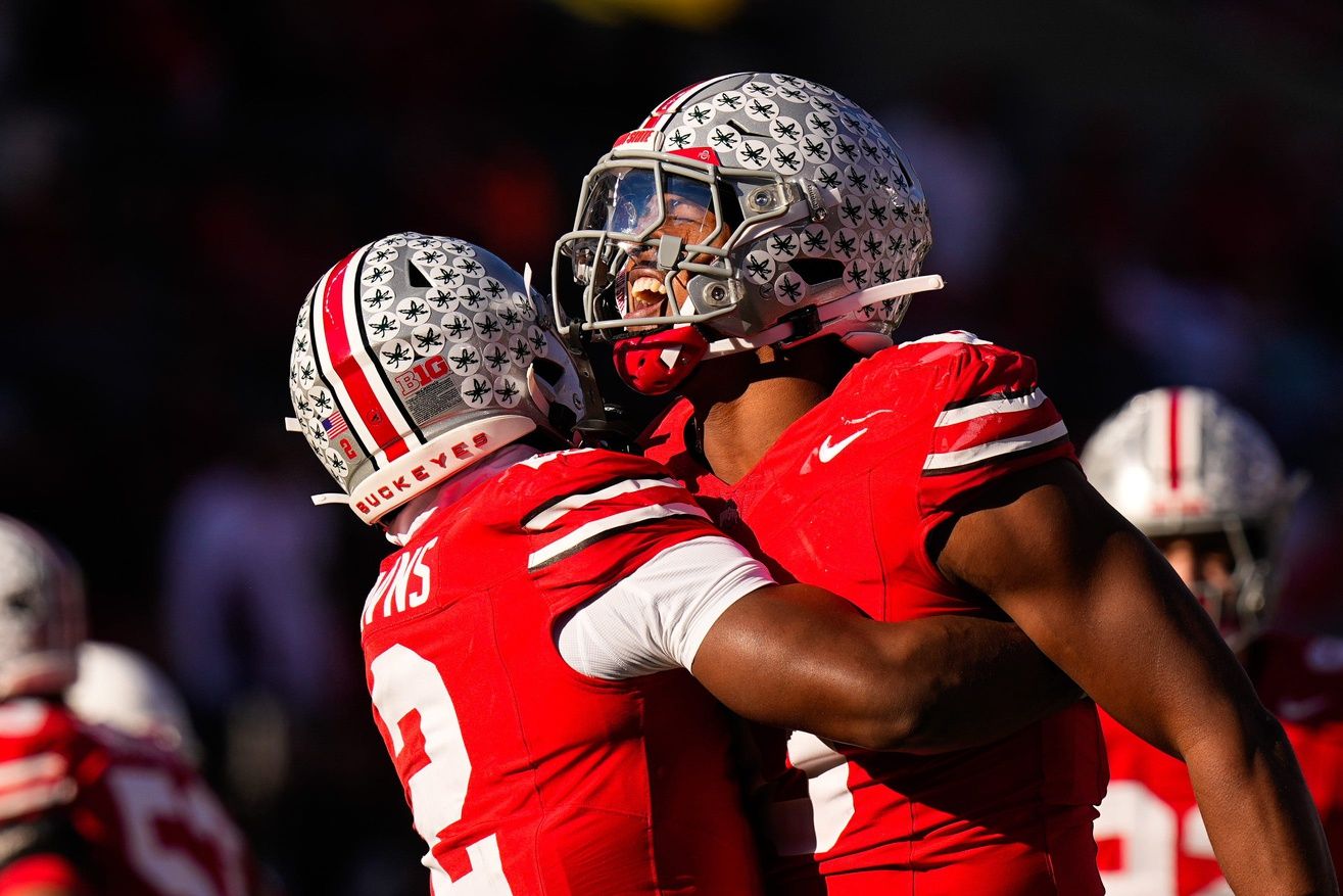 Ohio State Buckeyes defensive back Caleb Downs (2) celebrates with linebacker Sonny Styles (0) after sacking Rutgers Scarlet Knights quarterback Athan Kaliakmanis (16) in the second half of the NCAA football game at Ohio Stadium on Saturday, Nov. 22, 2025 in Columbus, Ohio.
