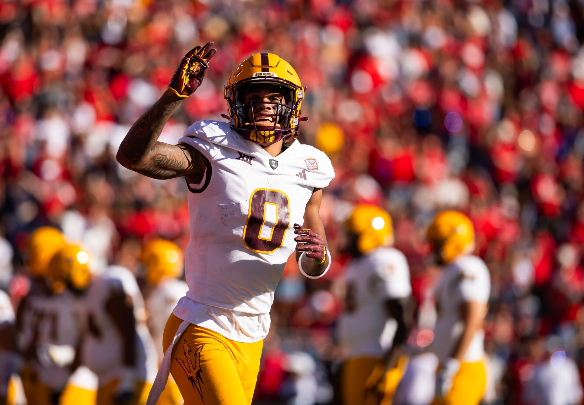 Arizona State Sun Devils wide receiver Jordyn Tyson (0) celebrates a touchdown against the Arizona Wildcats in the first half during the Territorial Cup at Arizona Stadium.