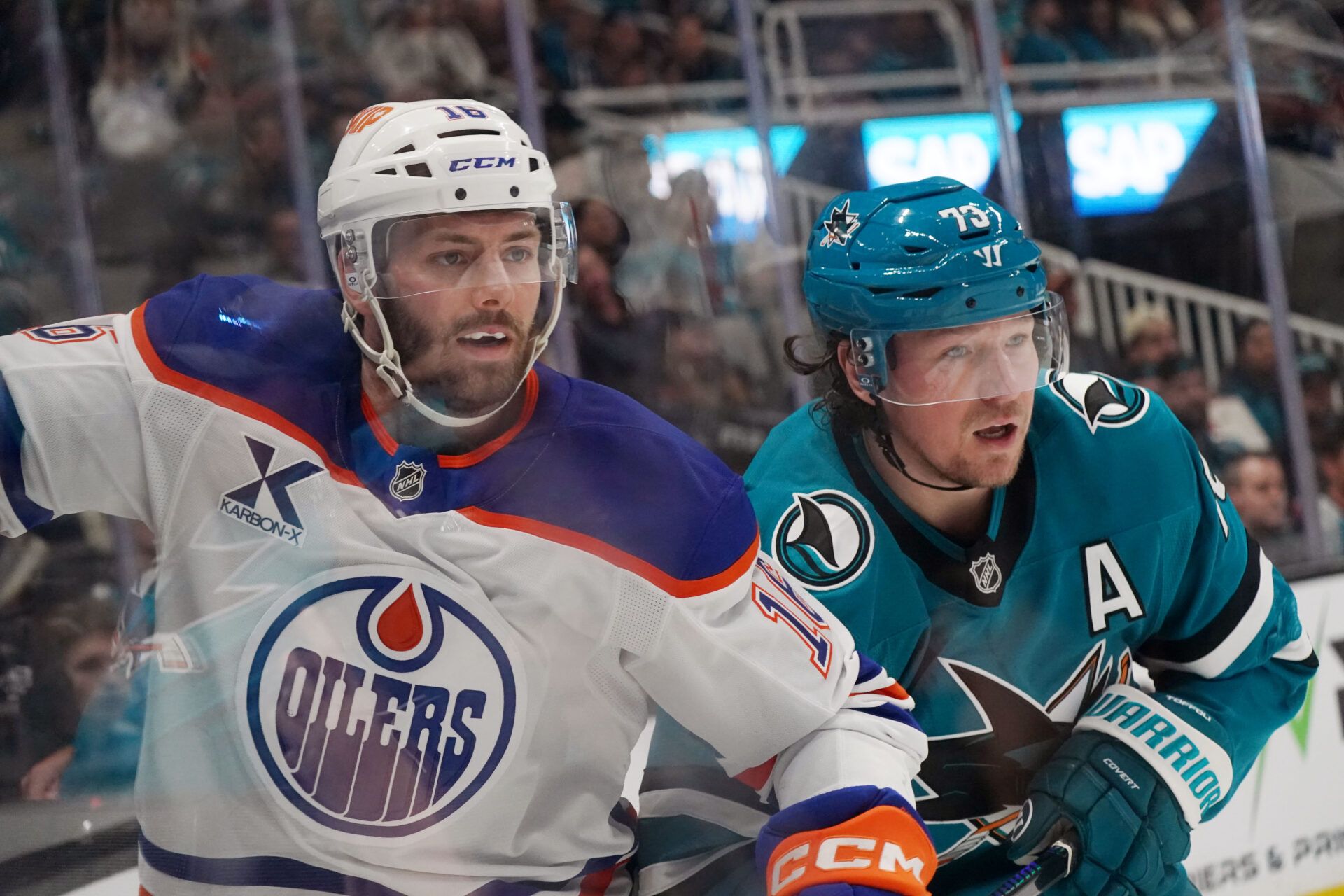 Edmonton Oilers center Jason Dickinson (16) and San Jose Sharks center Tyler Toffoli (73) watch the puck in the second period at SAP Center at San Jose.