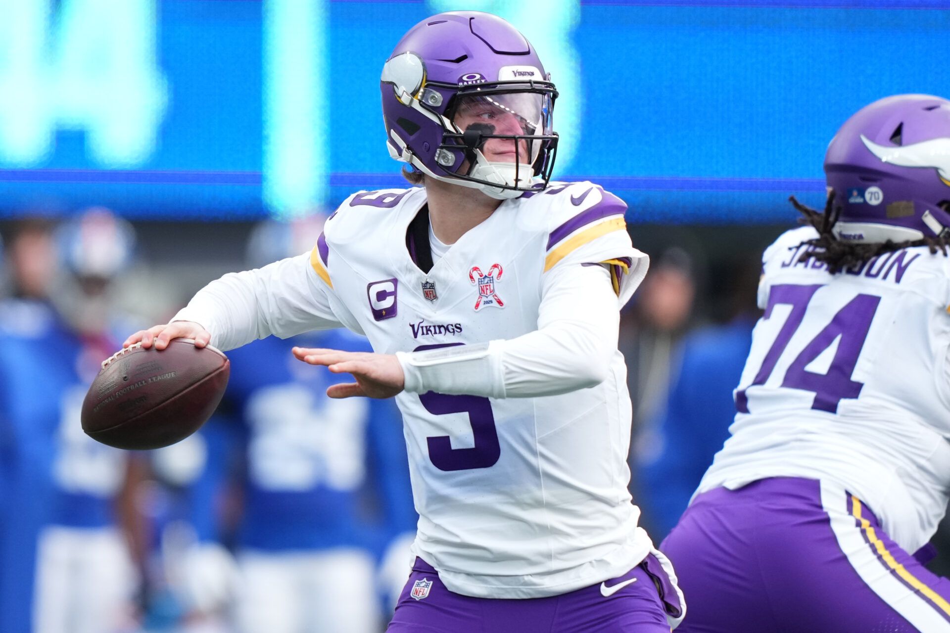 Minnesota Vikings quarterback J.J. McCarthy (9) drops back to pass against the New York Giants during the first half at MetLife Stadium.