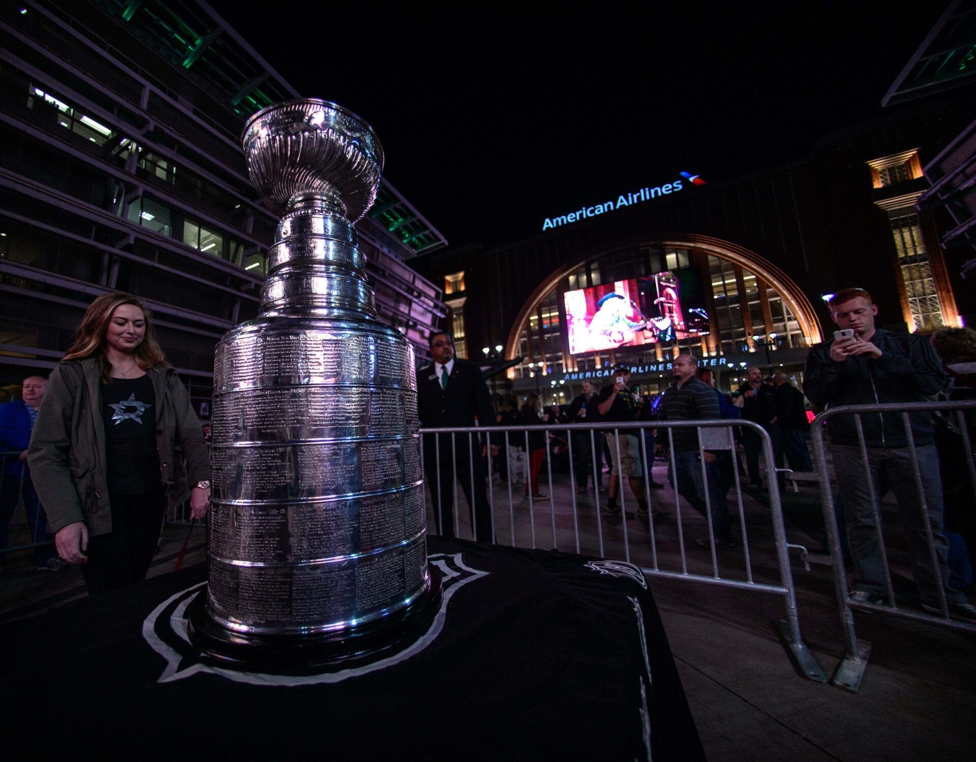 Fans line up to have their photo taken with the Stanley Cup before the game between the Dallas Stars and the Minnesota Wild at the American Airlines Center.
