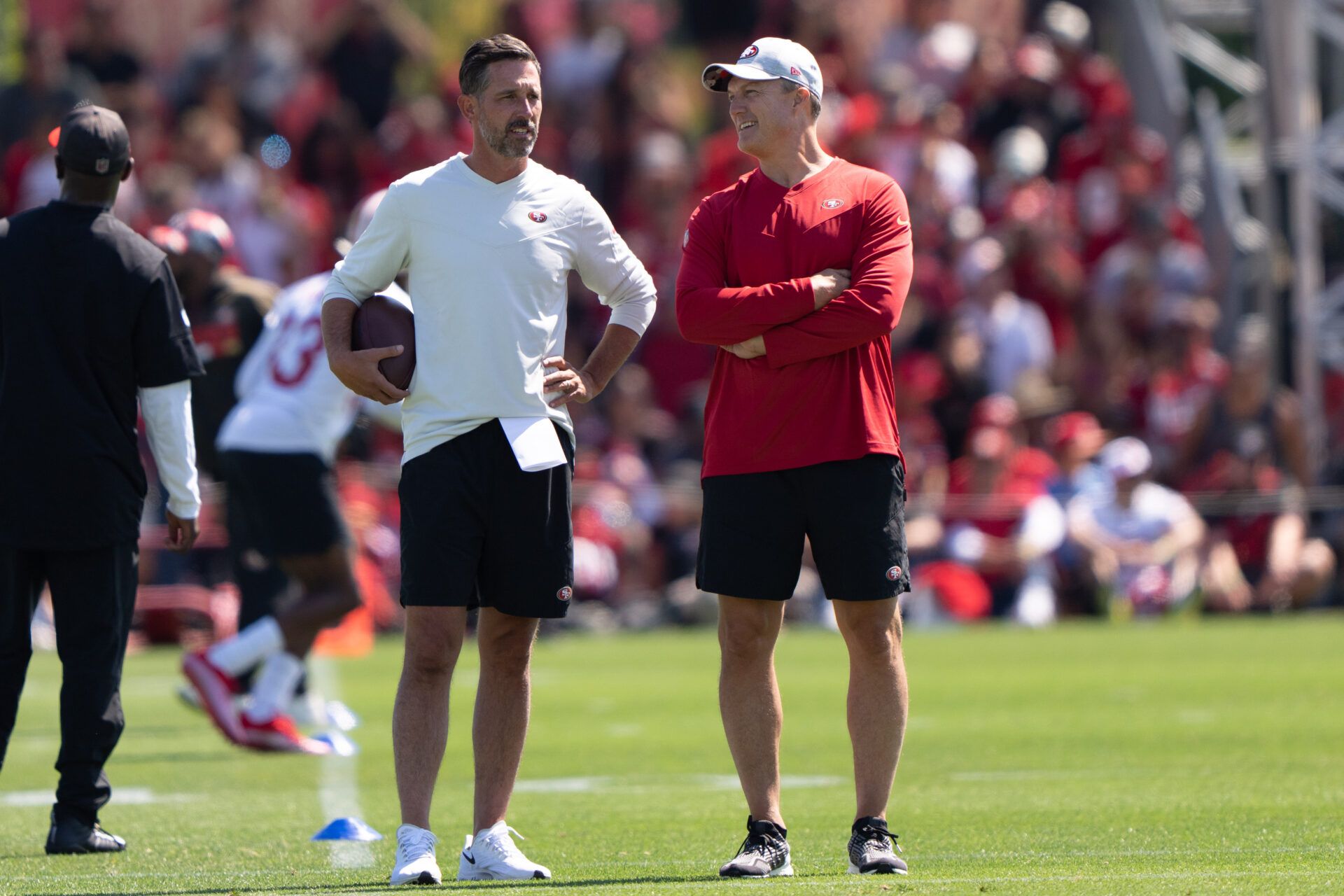 San Francisco 49ers head coach Kyle Shanahan (left) and general manager John Lynch watches the players during Training Camp at the SAP Performance Facility near Levi Stadium.