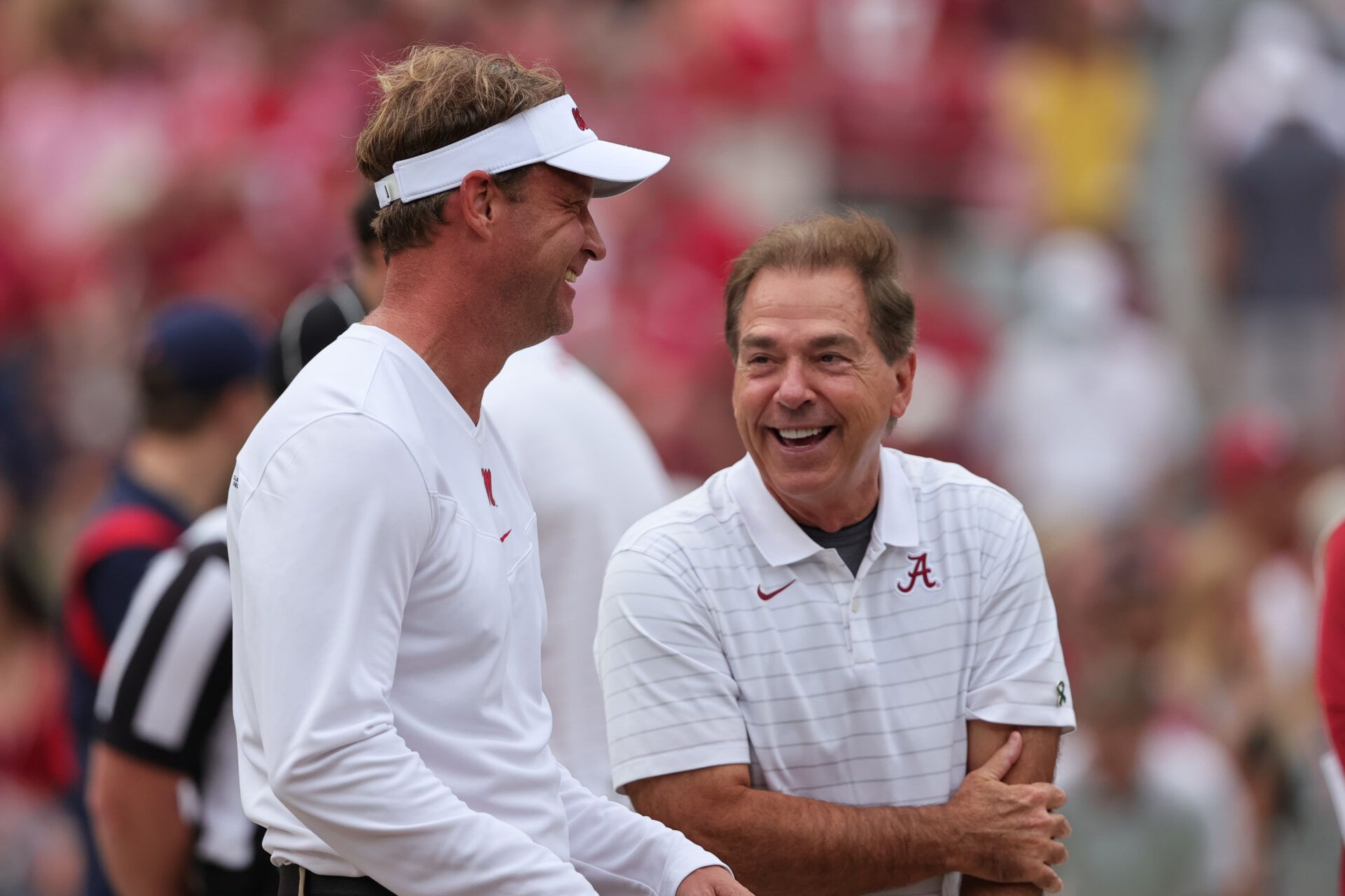 Mississippi Rebels head coach Lane Kiffin talks with Alabama Crimson Tide head coach Nick Saban before the start of an NCAA college football game at Bryant-Denny Stadium.
