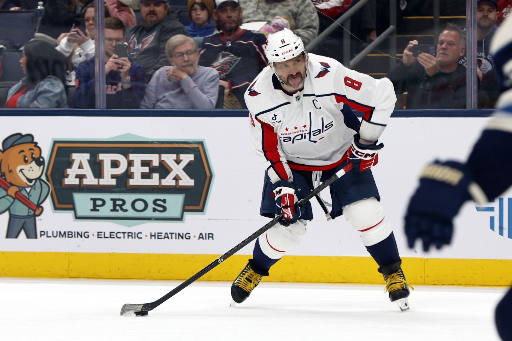 Washington Capitals left wing Alex Ovechkin (8) wrists a shot on goal against the Columbus Blue Jackets during the third period at Nationwide Arena.
