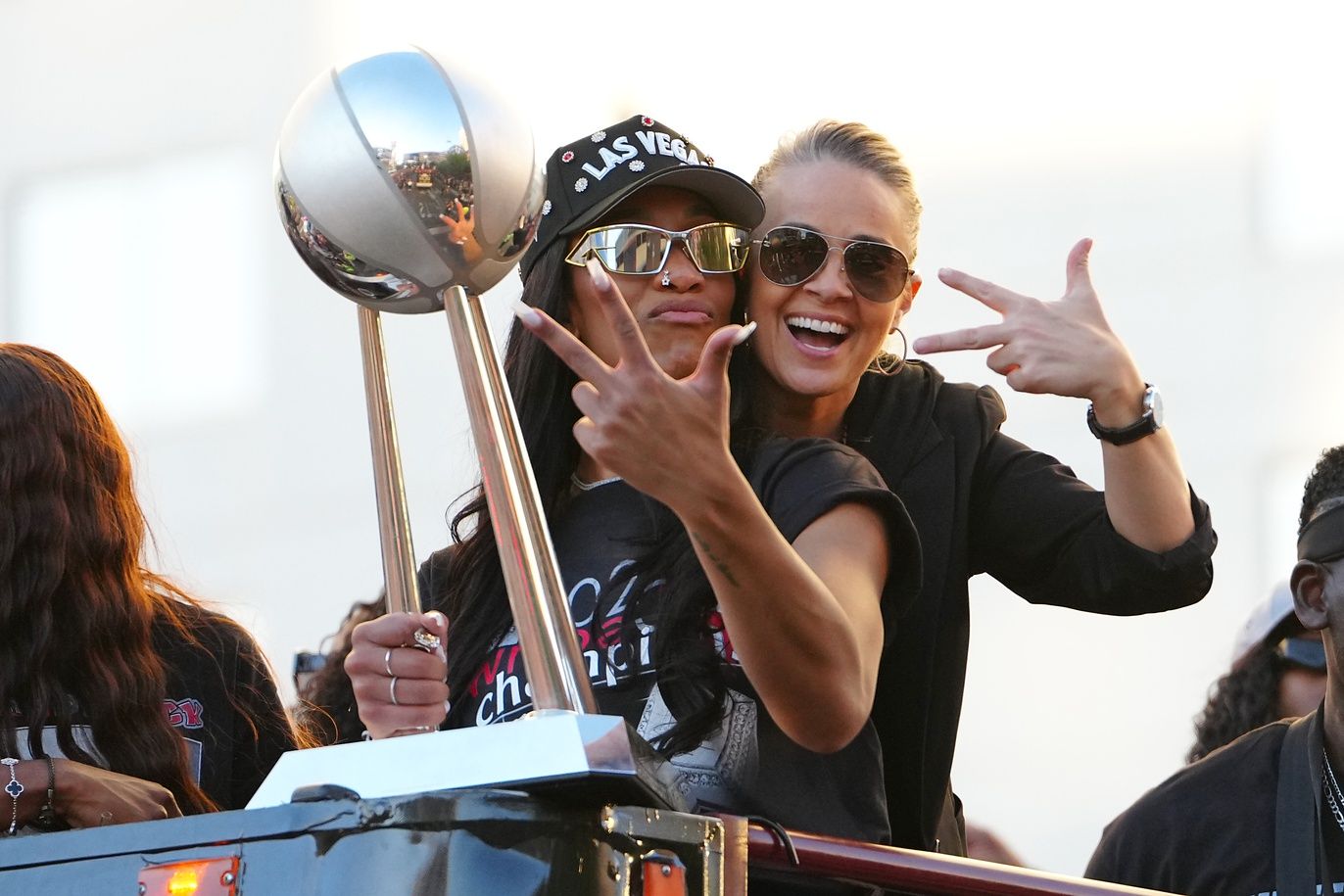 Las Vegas Aces center A'Ja Wilson (22) and head coach Becky Hammond pose for a photo during the 2025 WNBA Championship parade at Toshiba Plaza.