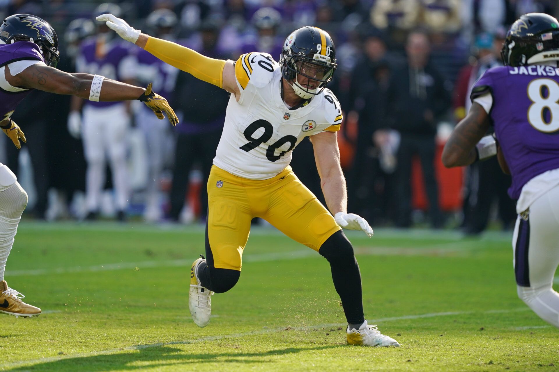 Pittsburgh Steelers linebacker T.J. Watt (90) chases down Baltimore Ravens quarterback Lamar Jackson (8) during the first half at M&T Bank Stadium.