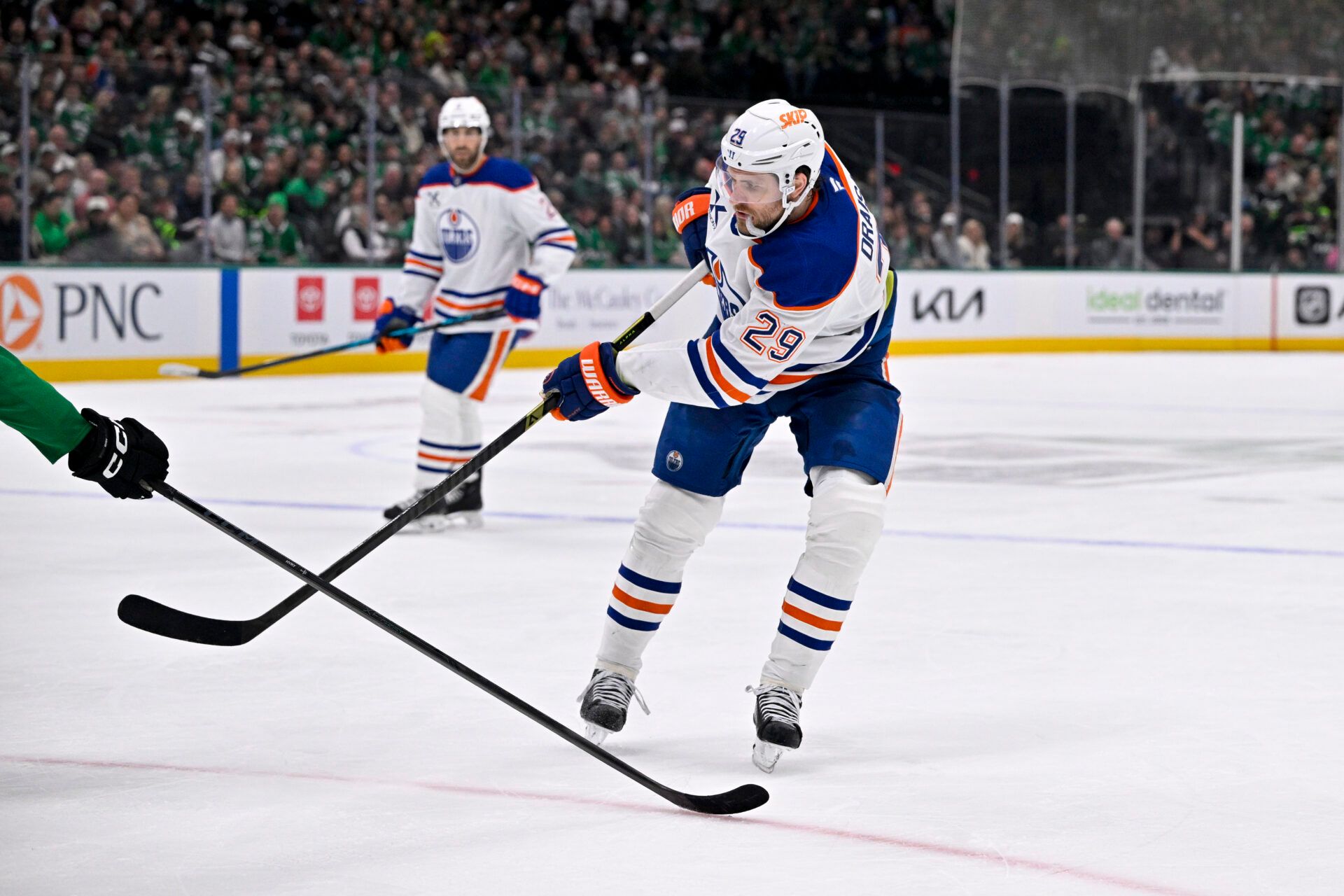 Edmonton Oilers center Leon Draisaitl (29) passes the puck during the game between the Stars and the Oilers at the American Airlines Center.