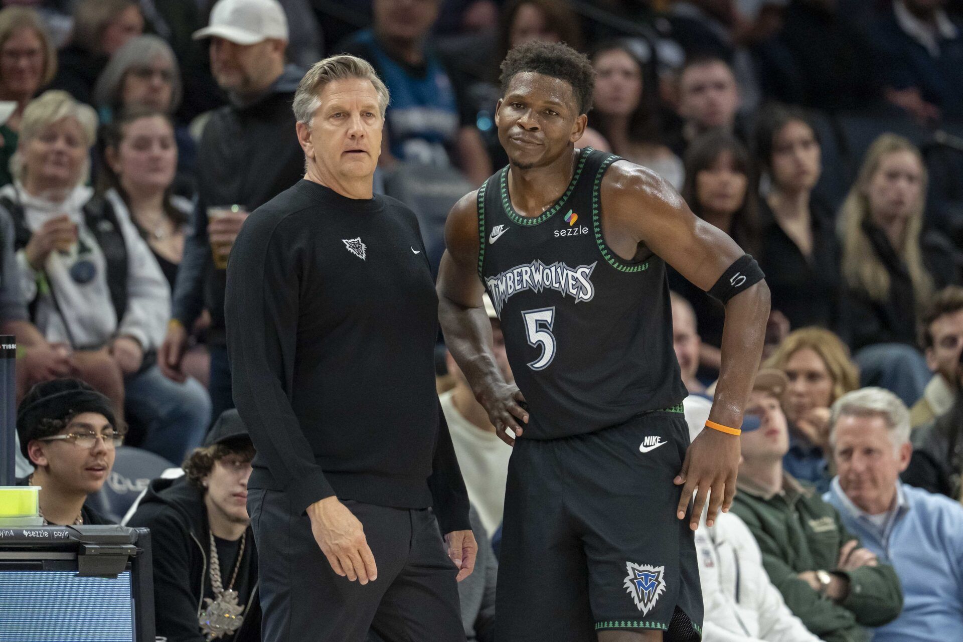 Minnesota Timberwolves head coach Chris Finch and guard Anthony Edwards (5) in the second half against the Memphis Grizzlies at Target Center.