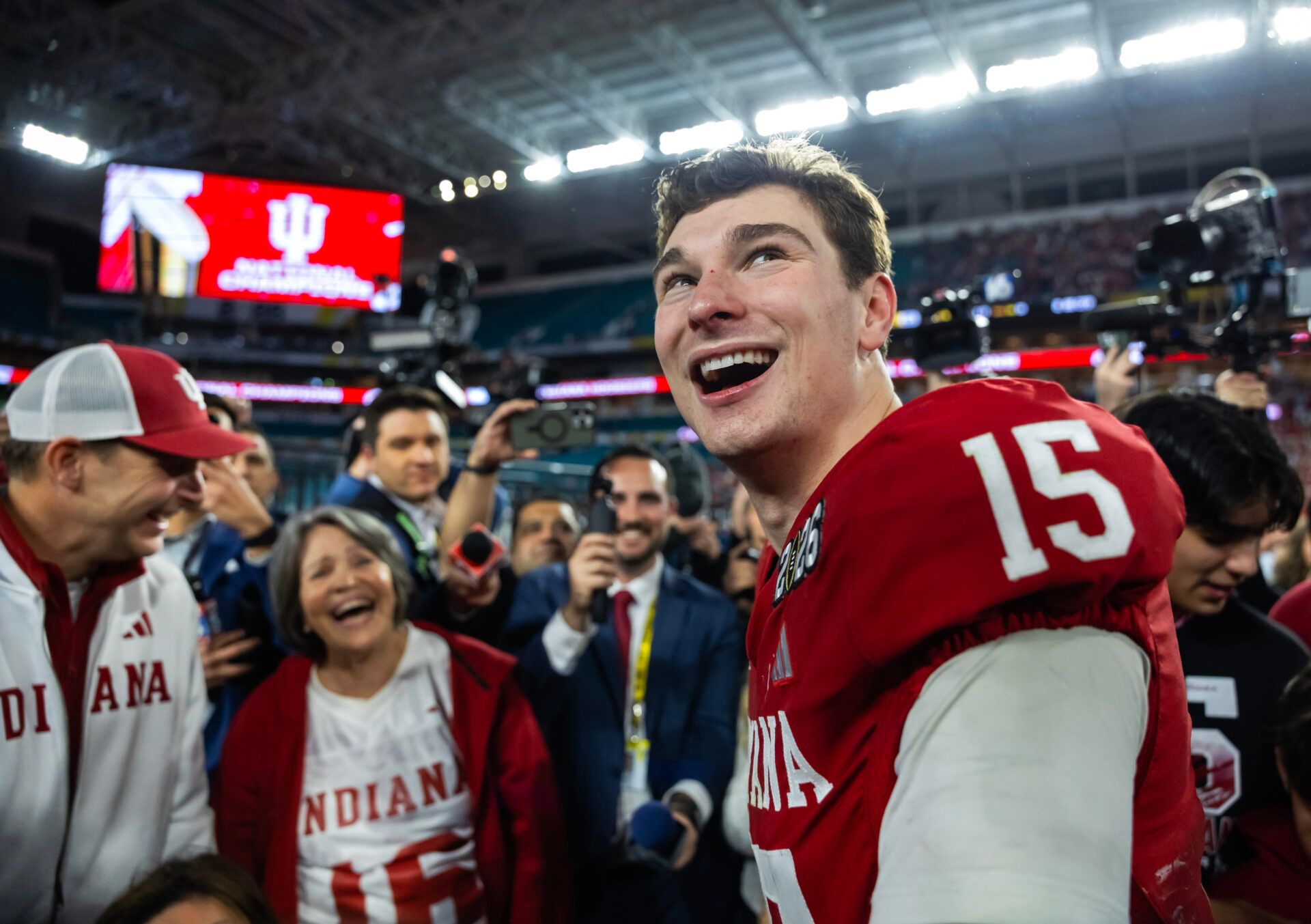 Indiana Hoosiers quarterback Fernando Mendoza (15) celebrates with family members after defeating the Miami Hurricanes in the College Football Playoff National Championship game at Hard Rock Stadium.