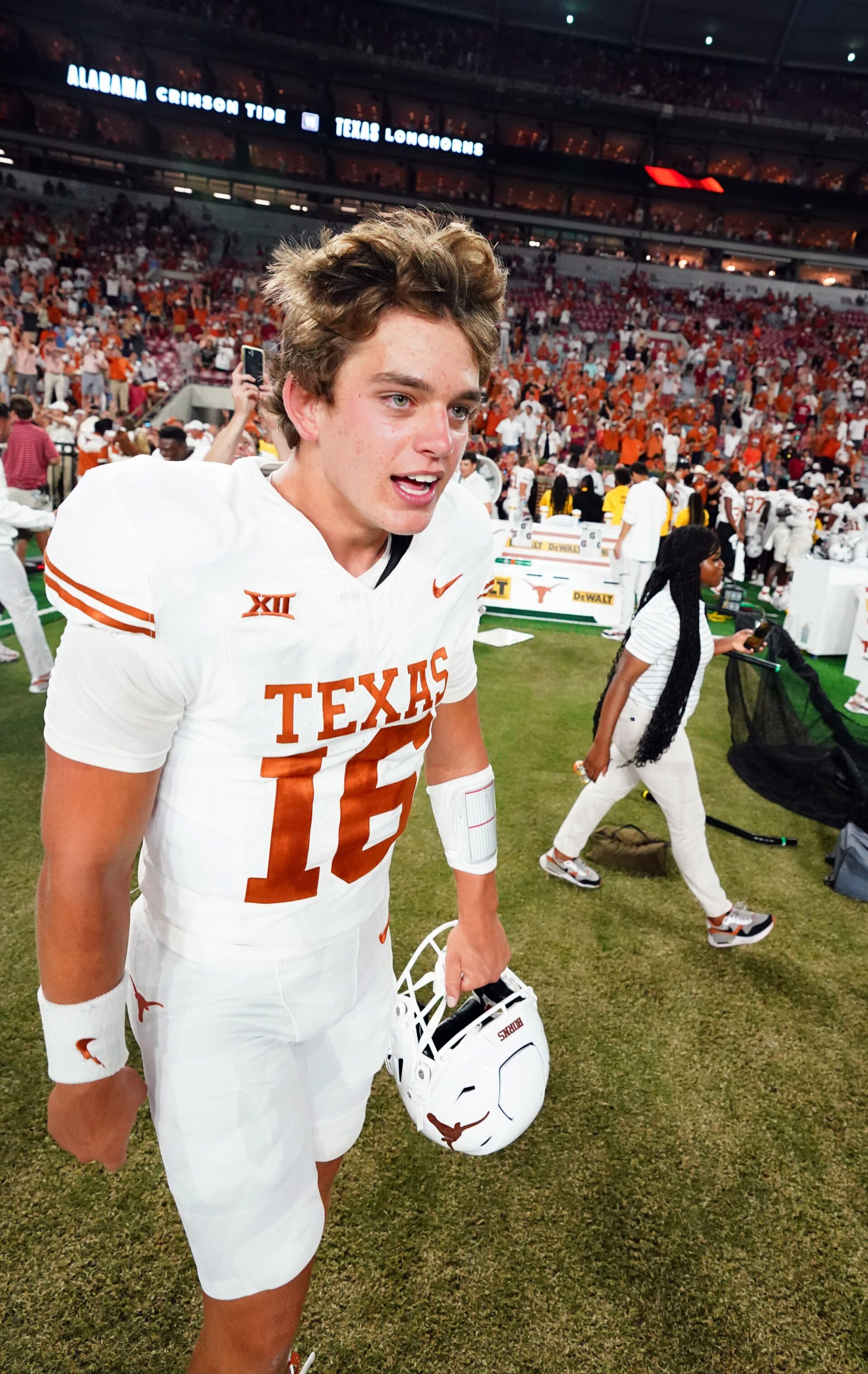 Texas Longhorns quarterback Arch Manning (16) celebrates their 34-24 victory over the Alabama Crimson Tide at Bryant-Denny Stadium.
