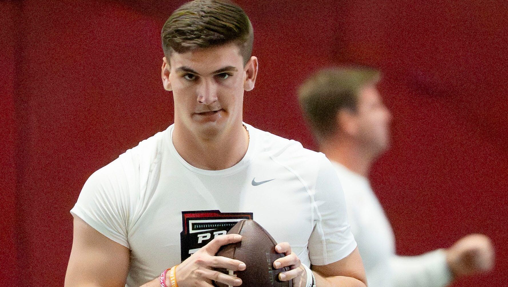 Quarterback Ty Simpson goes through his warm up during Pro Day in the Hank Crisp Indoor Practice Facility at the University of Alabama.