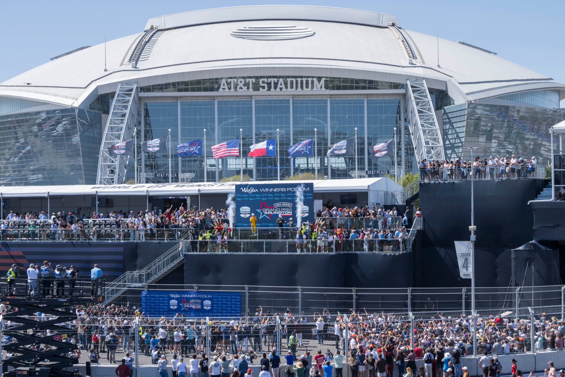 A view of AT&T Stadium and the track and the winner’s podium and fans after the 2026 IndyCar race at Streets of Arlington.