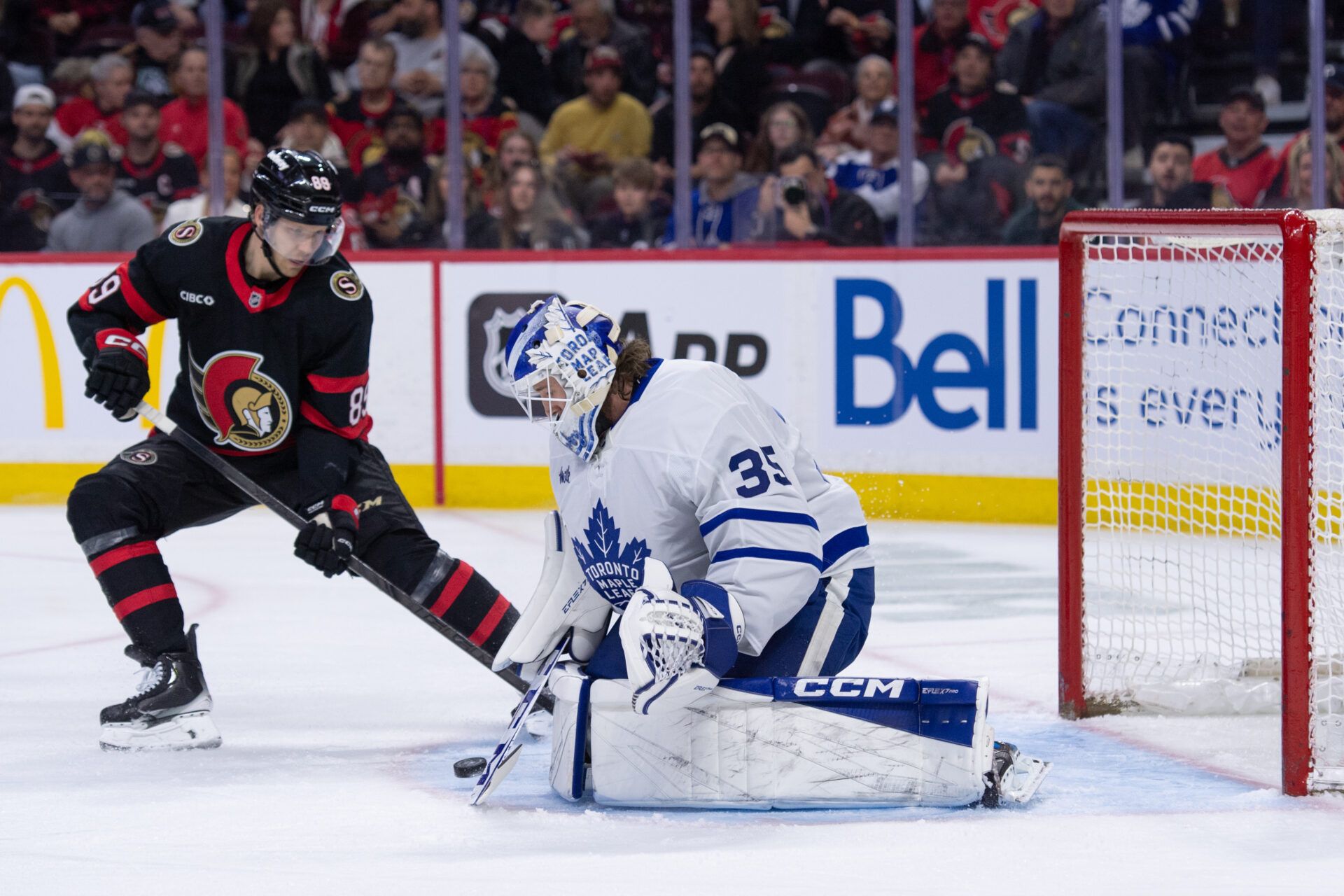 Toronto Maple Leafs goalie Dennis Hildeby (35) makes a save in front of Ottawa Senators center Lars Eller (89) in the first period at the Canadian Tire Centre.