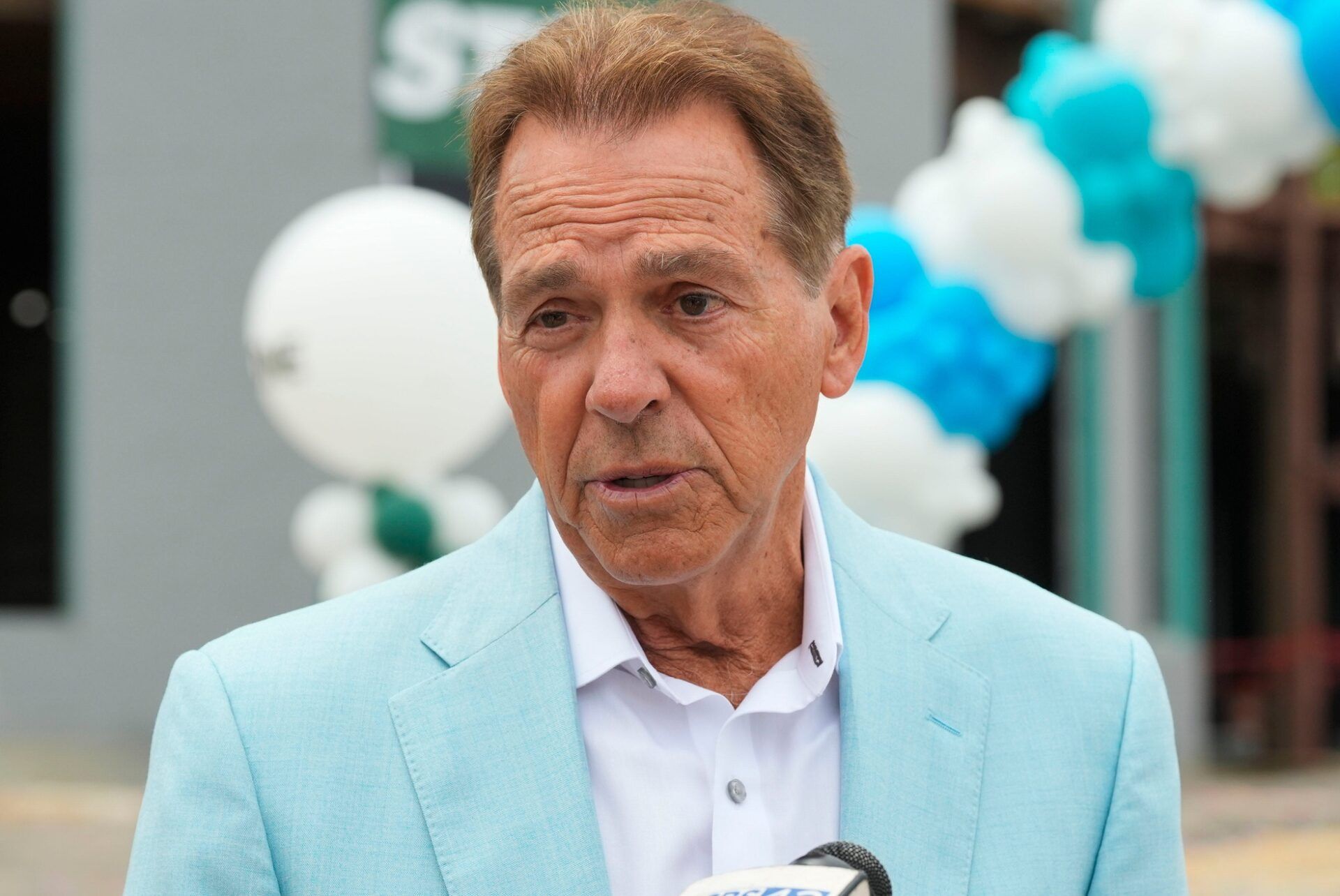 Nick Saban answer questions from the news media at the Saban Center Topping Out ceremony.