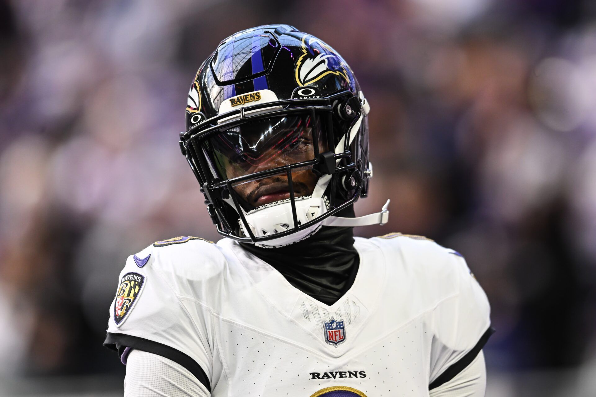 Baltimore Ravens quarterback Lamar Jackson (8) looks on before the game against the Minnesota Vikings at U.S. Bank Stadium.