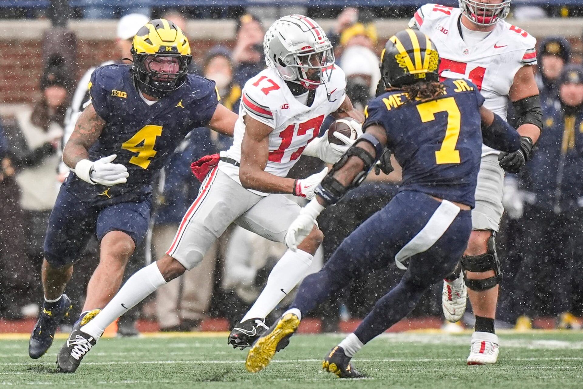 Ohio State wide receiver Carnell Tate (17) makes a catch against Michigan defensive back TJ Metcalf (7) during the first half at Michigan Stadium in Ann Arbor on Saturday, Nov. 29, 2025.