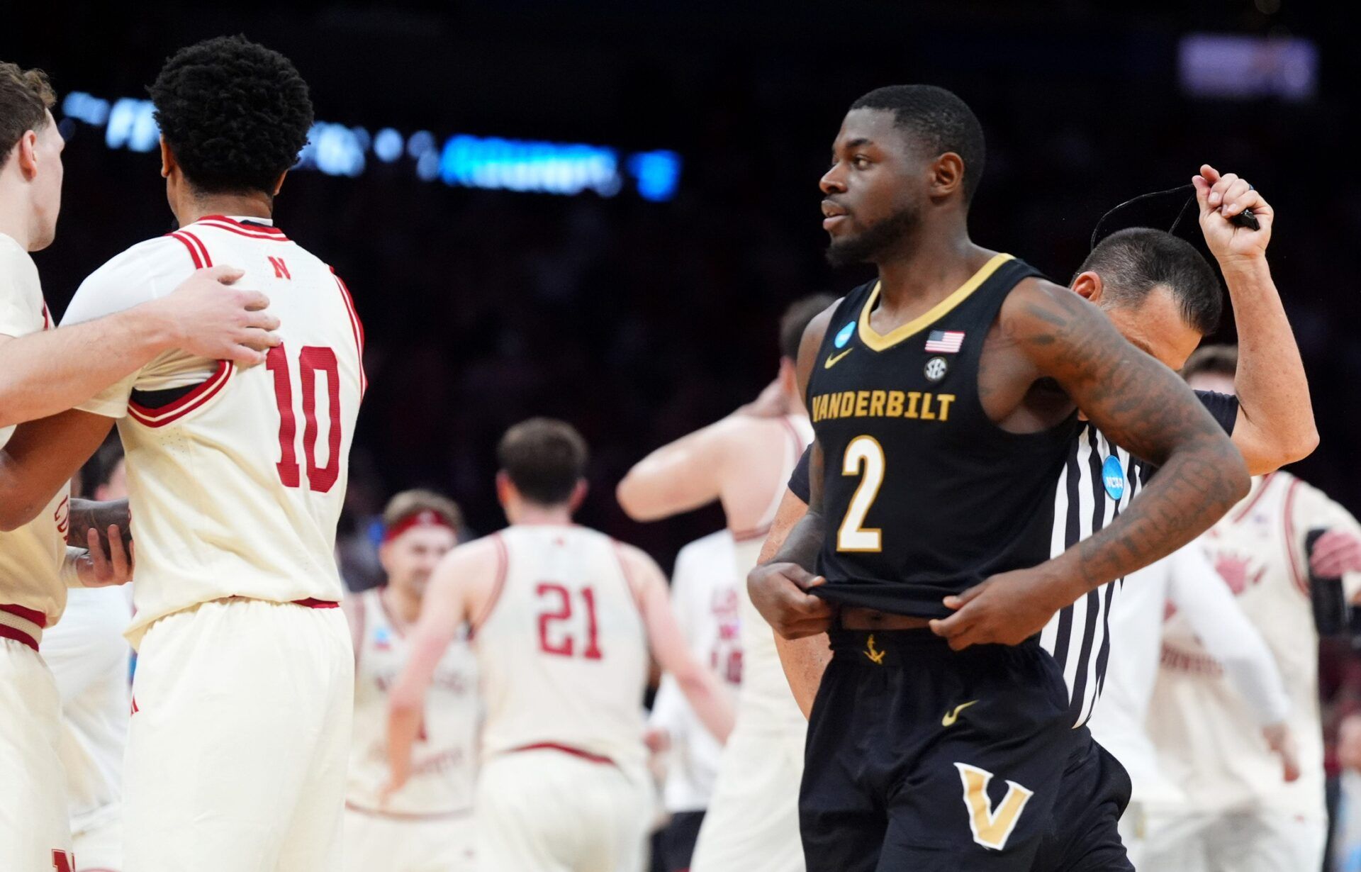 Vanderbilt's Duke Miles (2) walks off the court as Nebraska celebrates following a second-round game in the NCAA men's basketball tournament between Nebraska Cornhuskers and Vanderbilt Commodores at Paycom Center in Oklahoma City, Saturday March 21, 2026.
