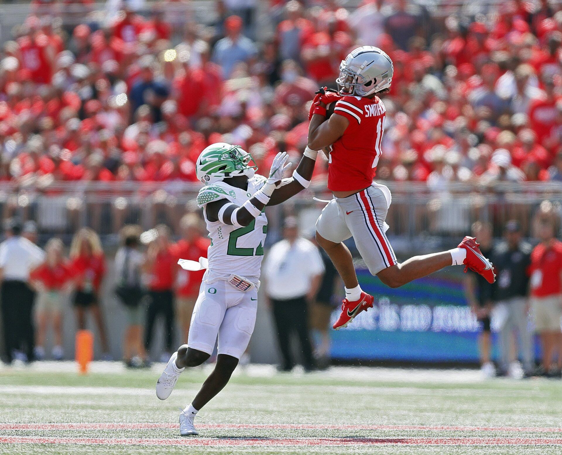 Ohio State Buckeyes wide receiver Jaxon Smith-Njigba (11) comes up with the catch against Oregon Ducks safety Verone McKinley III (23) during the third quarter in their NCAA Division I game on Saturday, September 11, 2021 at Ohio Stadium in Columbus, Ohio.
