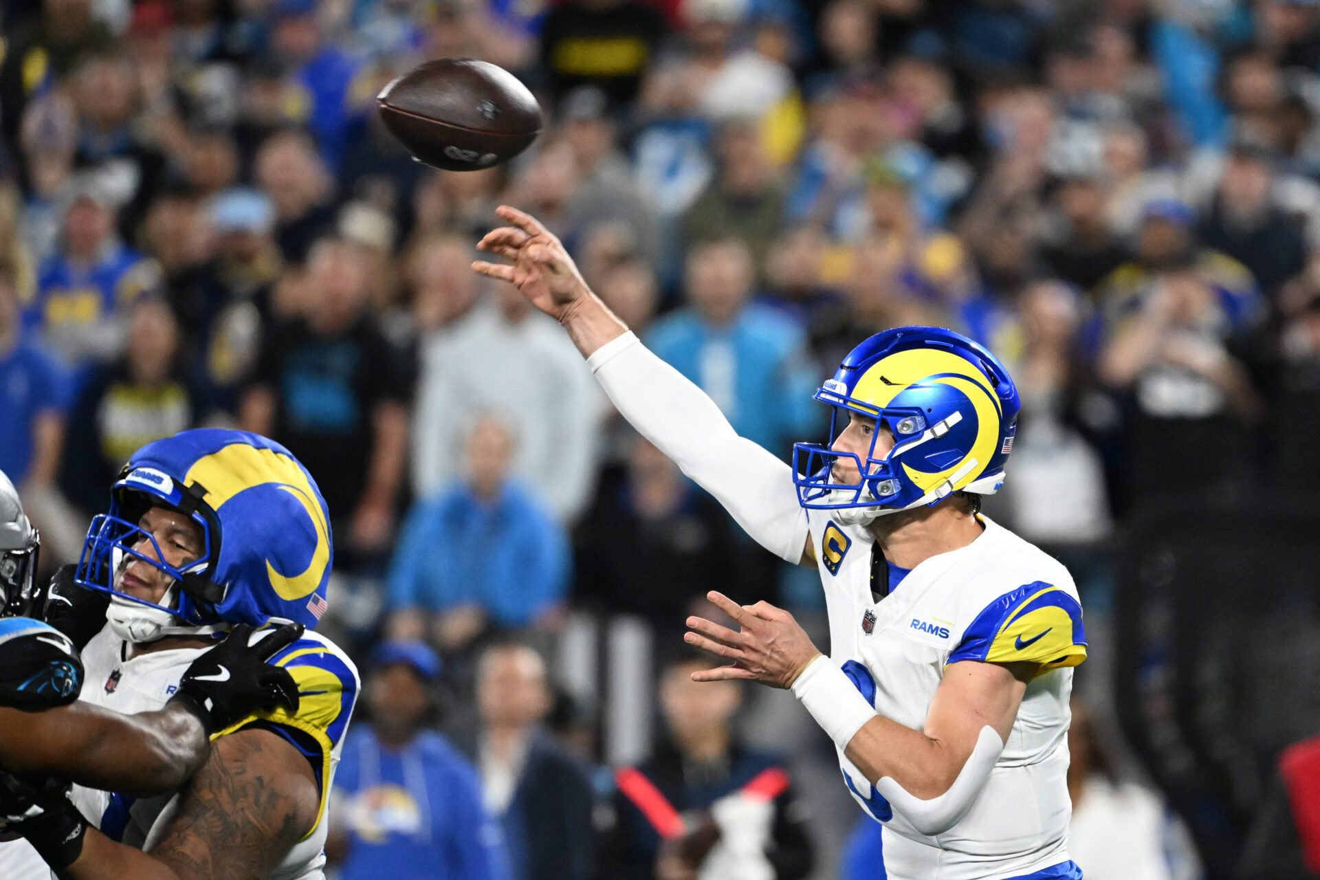 Los Angeles Rams quarterback Matthew Stafford (9) passes the ball in the fourth quarter in an NFC Wild Card Round game at Bank of America Stadium.