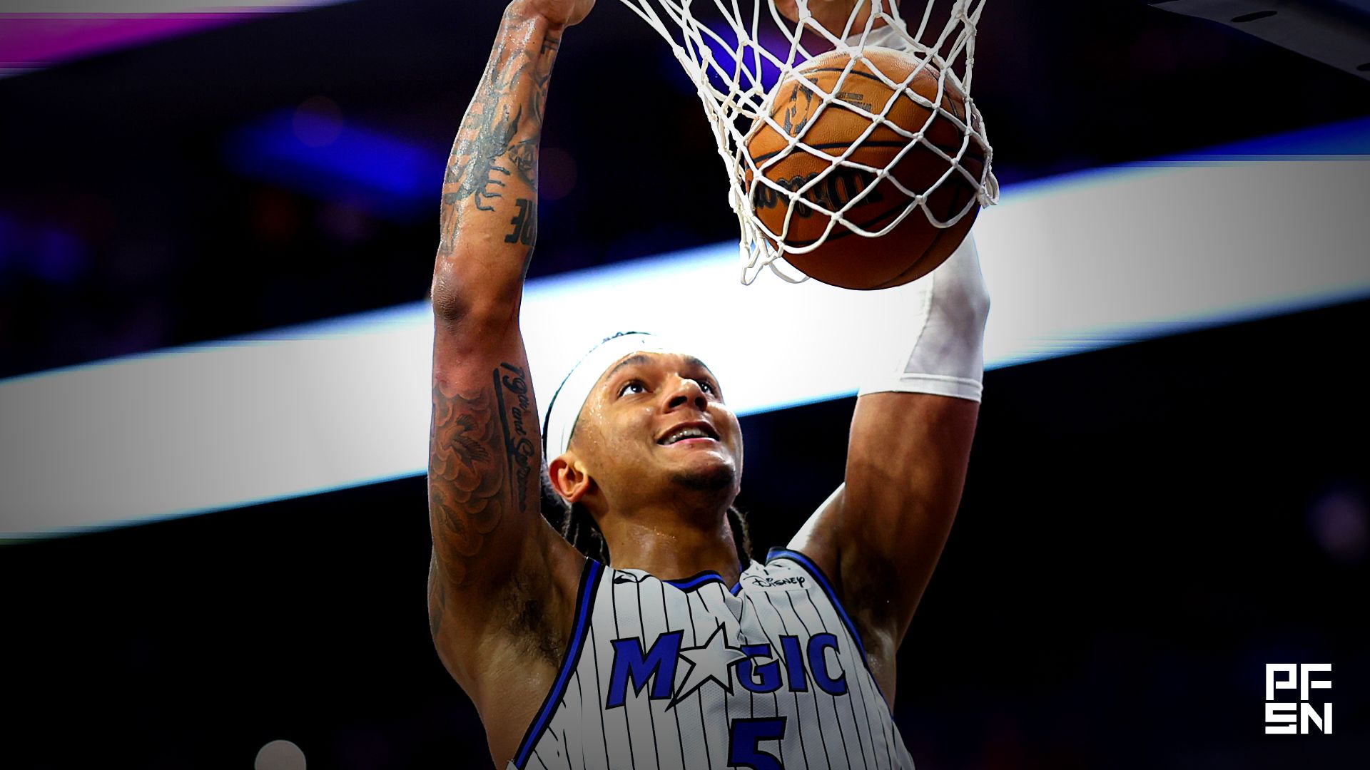 Orlando Magic forward Paolo Banchero (5) dunks the ball against the Philadelphia 76ers during the second quarter of a play-in round of the 2026 NBA Playoffs at Xfinity Mobile Arena.