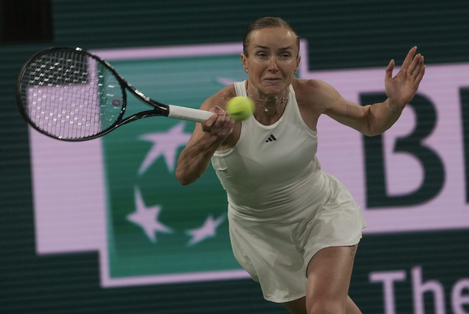Elina Svitolina reaches for a return during her loss to Elena Rybakina in the womens semifinal at the BNP Paribas Open at the Indian Wells Tennis Garden in Indian Wells, Calif., March 13, 2026.