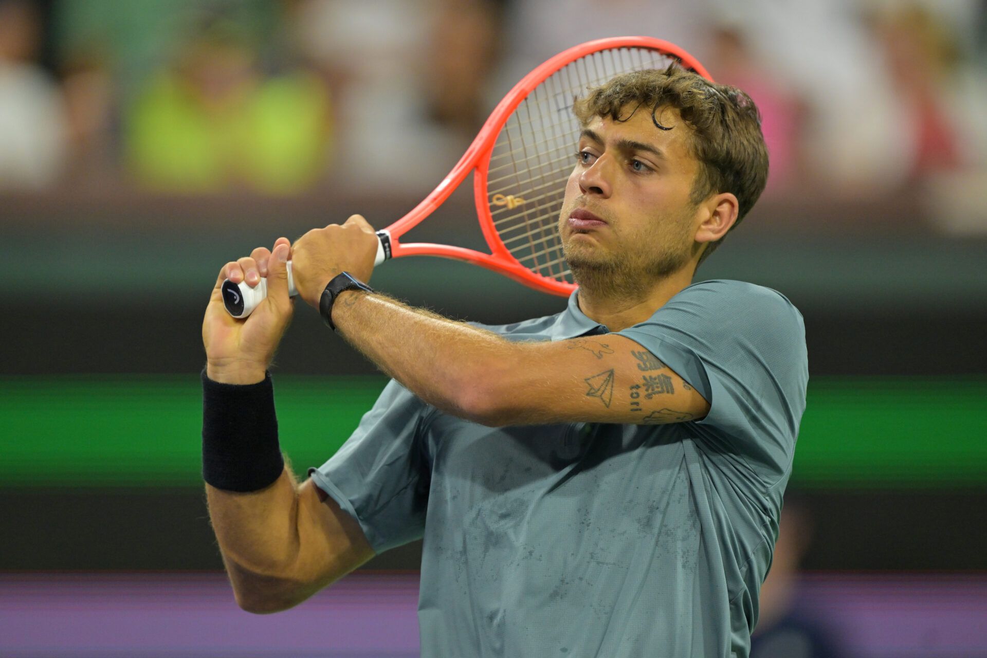 Flavio Cobolli (ITA) hits a shot during his third round match against Frances Tiafoe (USA) in the BNP Paribas Open at the Indian Wells Tennis Garden.